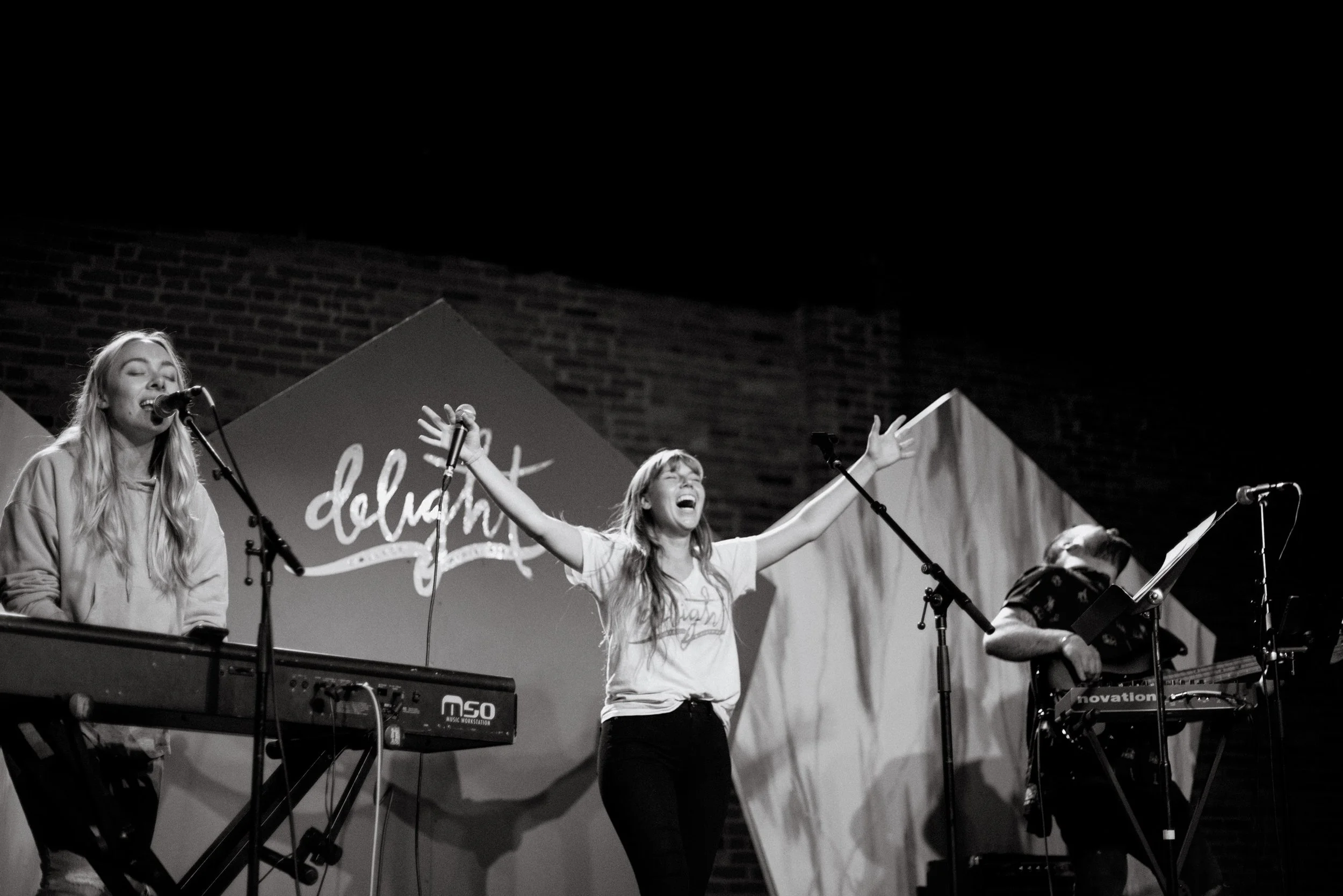 d259-woman-on-stage-worshipping.jpg
