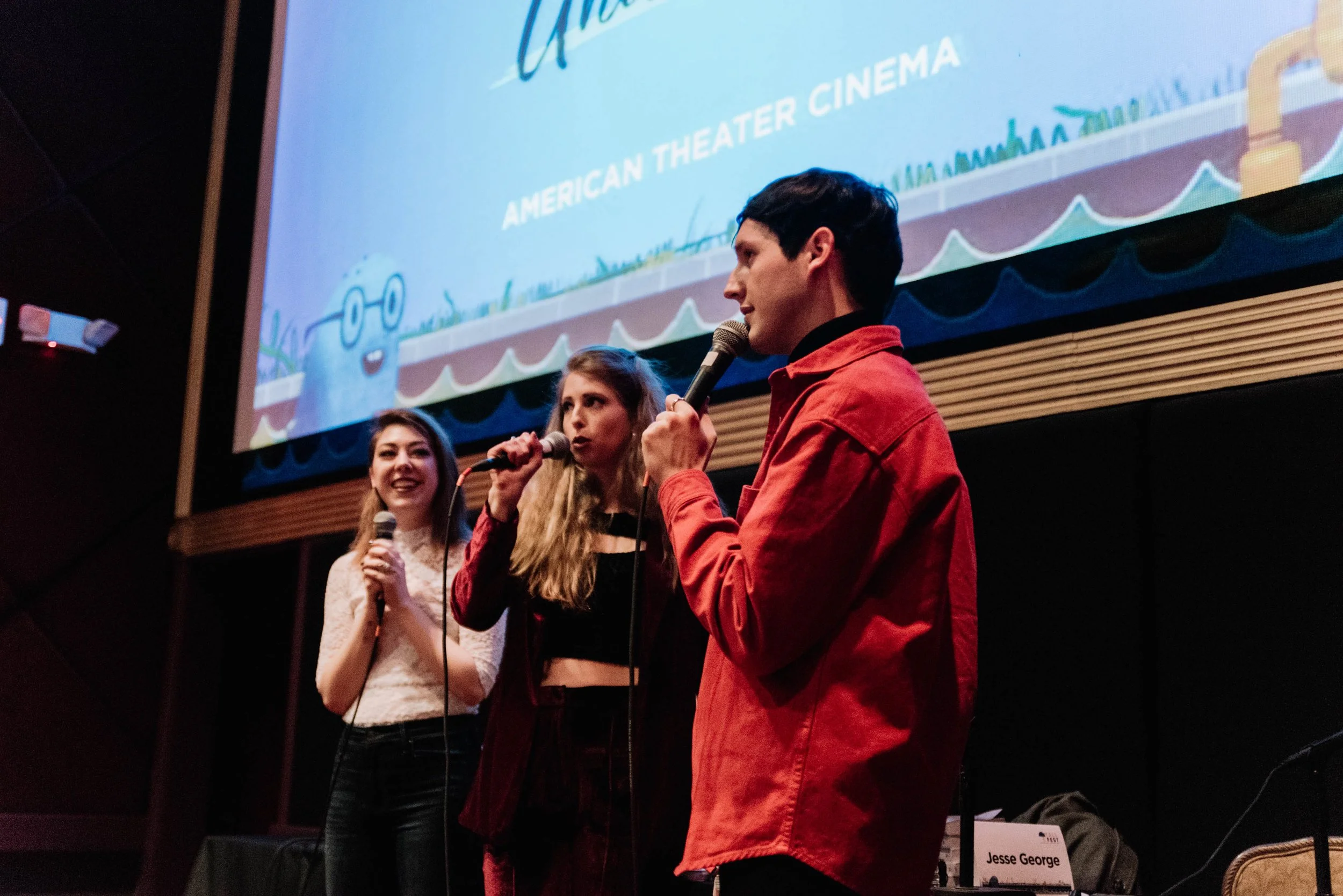 BT196-three-people-with-microphones.jpg