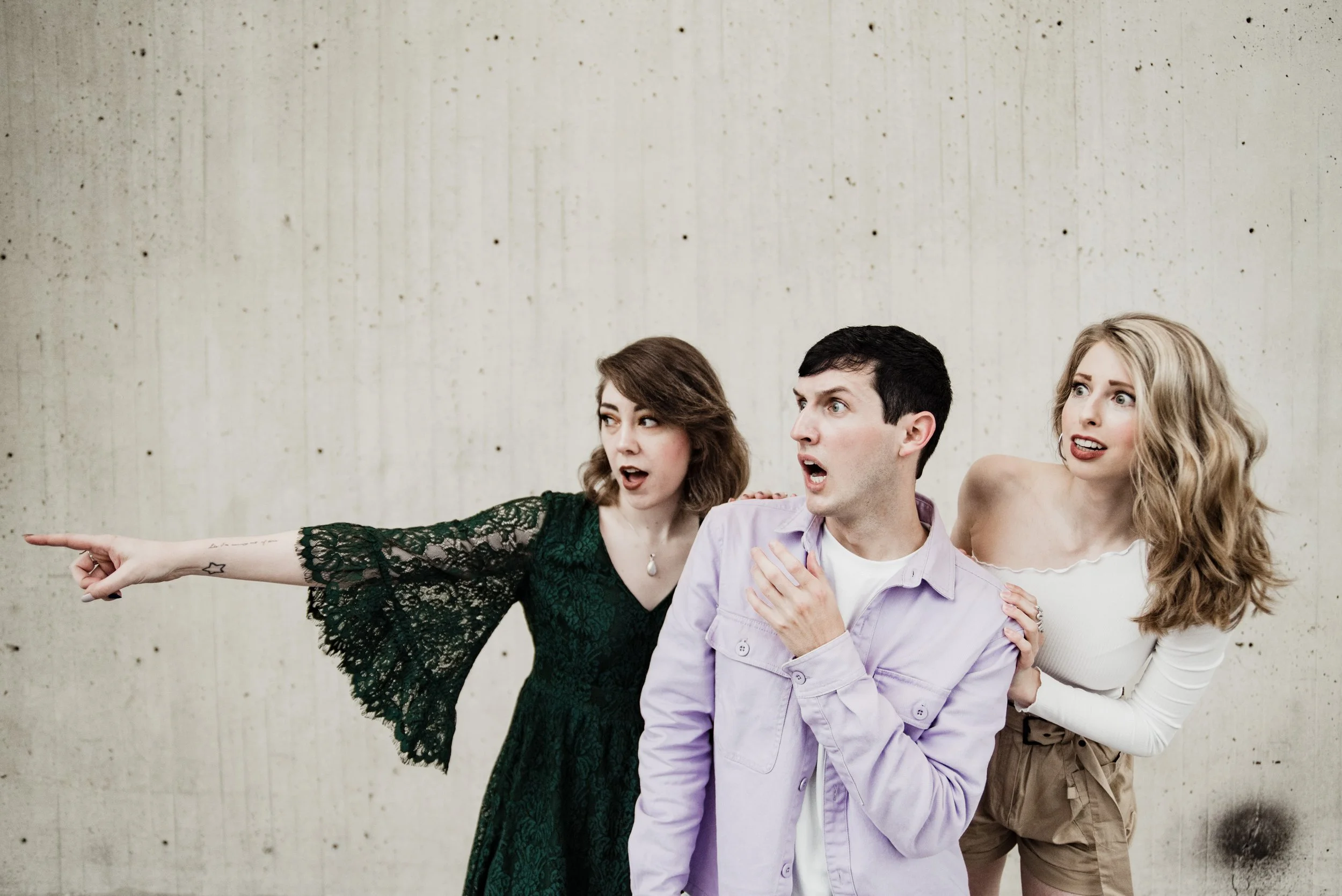 BT293-three-people-scared-concrete-background.jpg