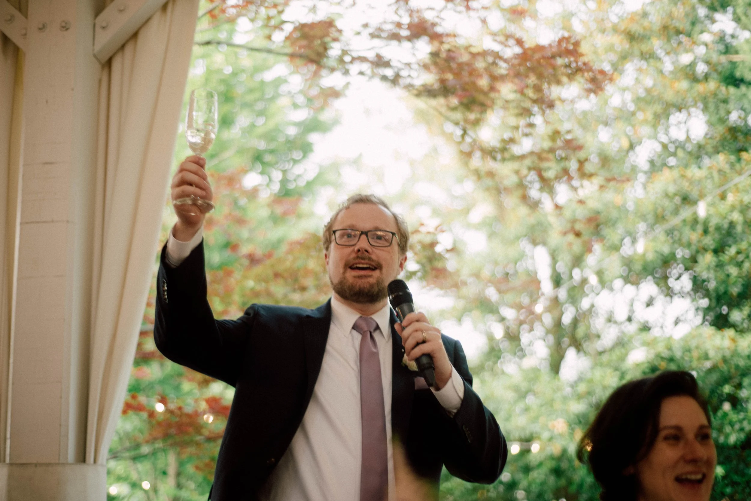 HRD58-brother-of-bride-raising-glass-during-toast.jpg