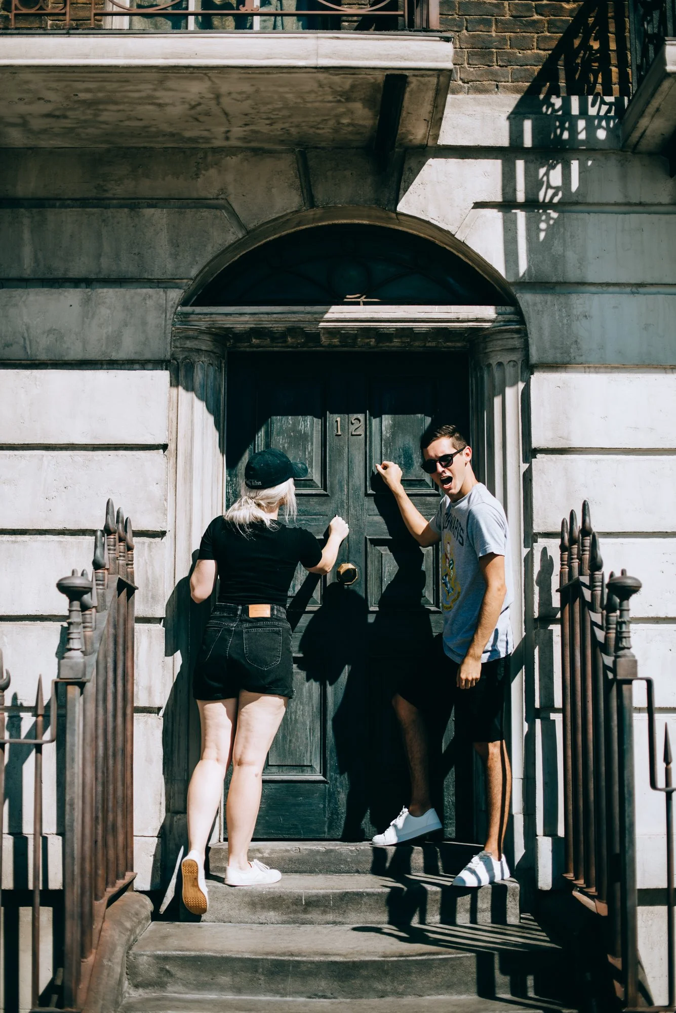 BT89-two-people-knocking-on-front-door.jpg