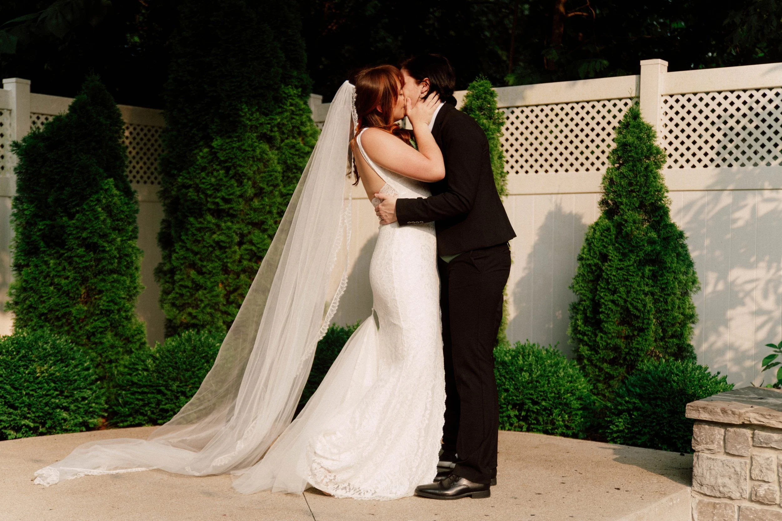 HRD30-lgbtq-brides-kissing-at-wedding-ceremony.jpg