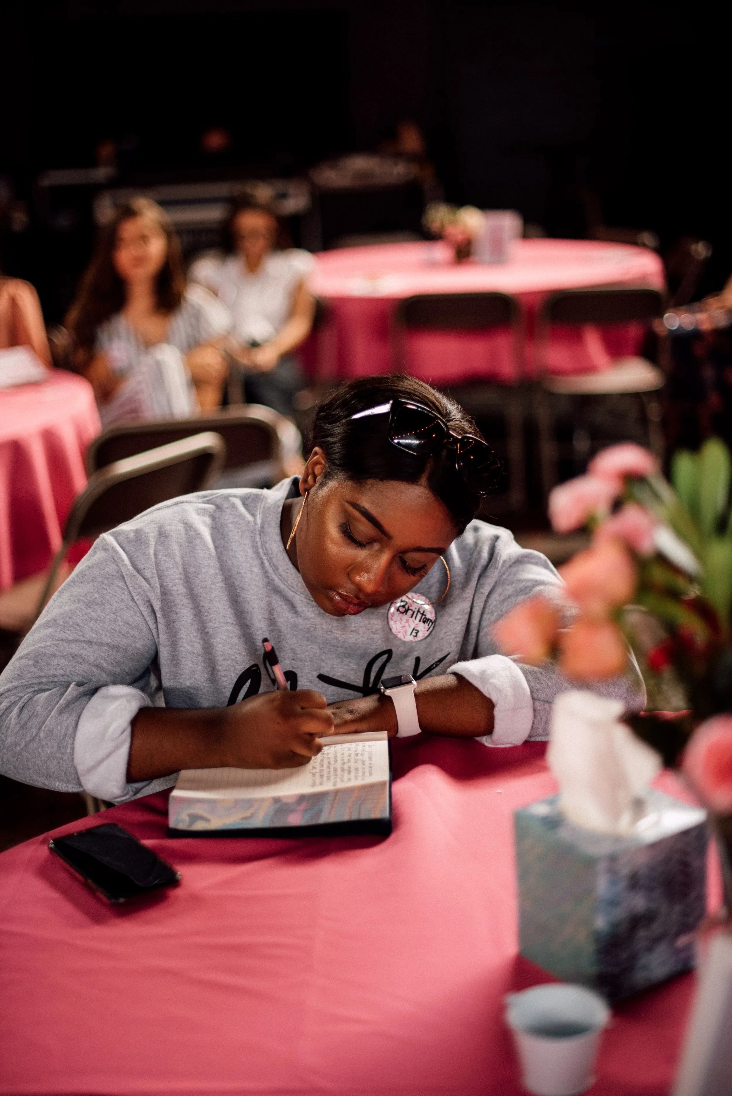d249-black-woman-journaling-conference.jpg