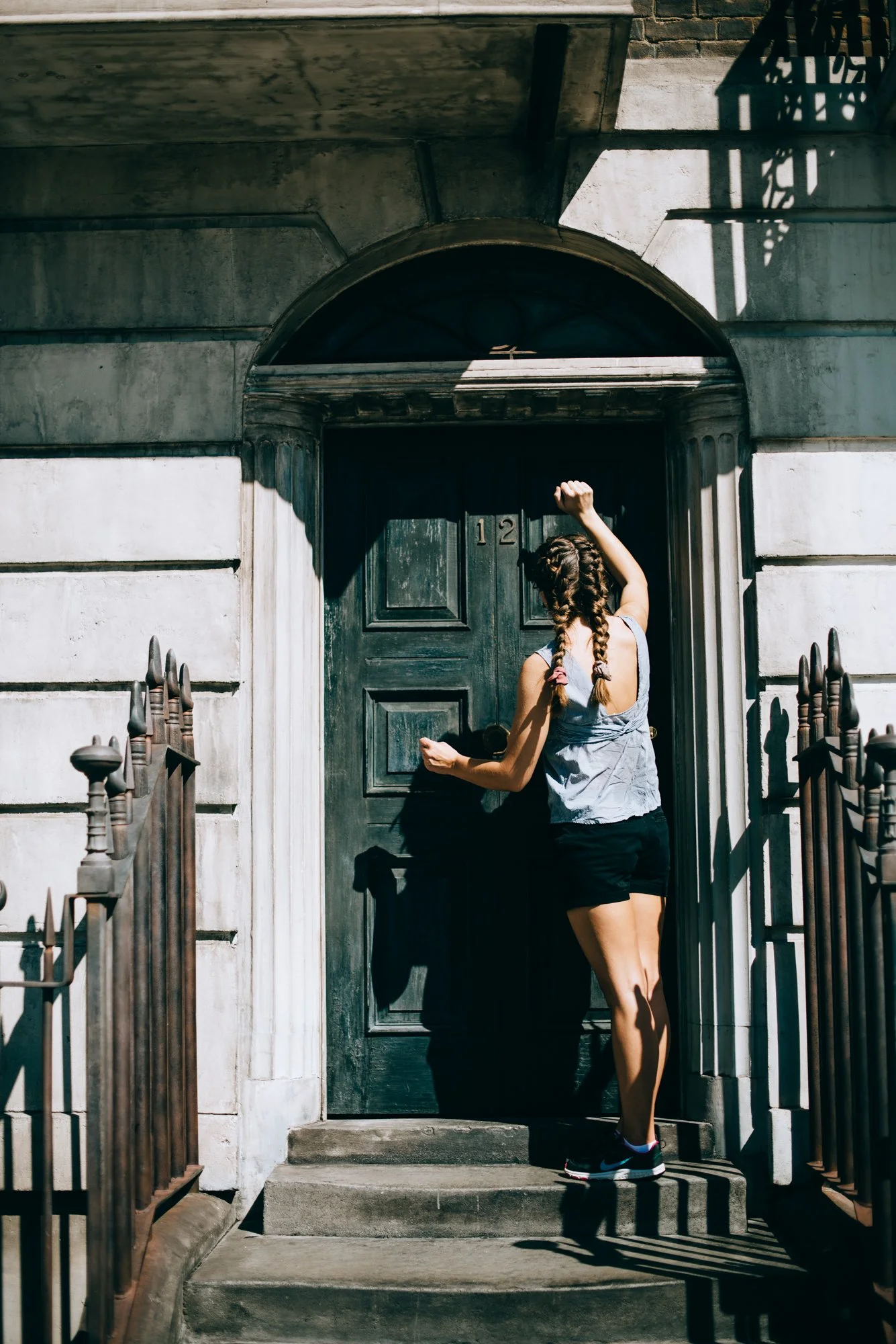 BT91-woman-knocking-on-front-door.jpg
