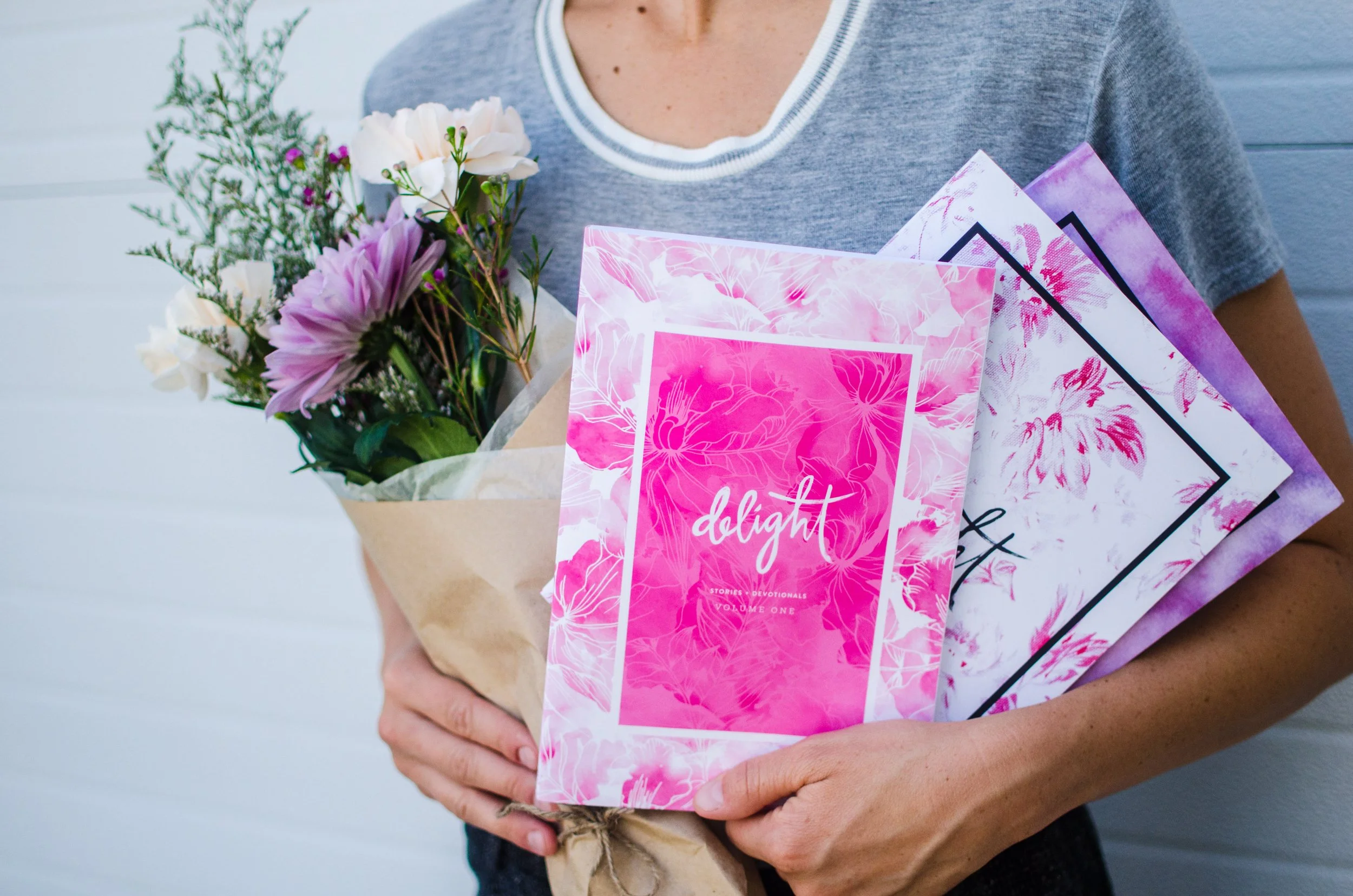 d158-person-holding-flowers-delight-books.jpg