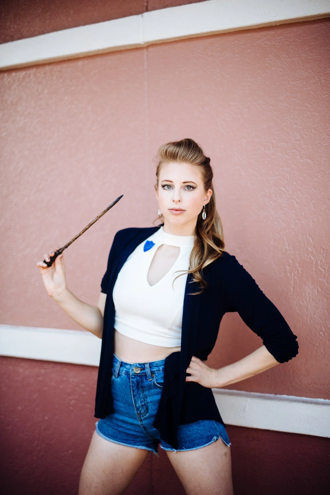BT82-white-woman-wand-pink-wall.jpg