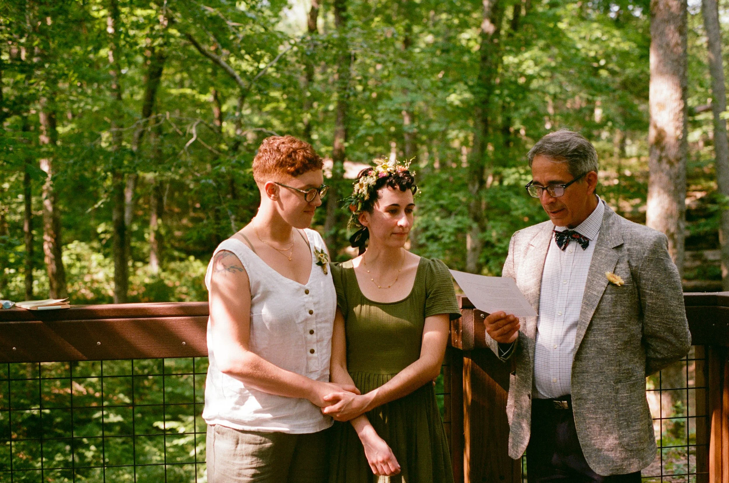 REW49-father-reading-with-couple-at-lgbtq-wedding.jpg