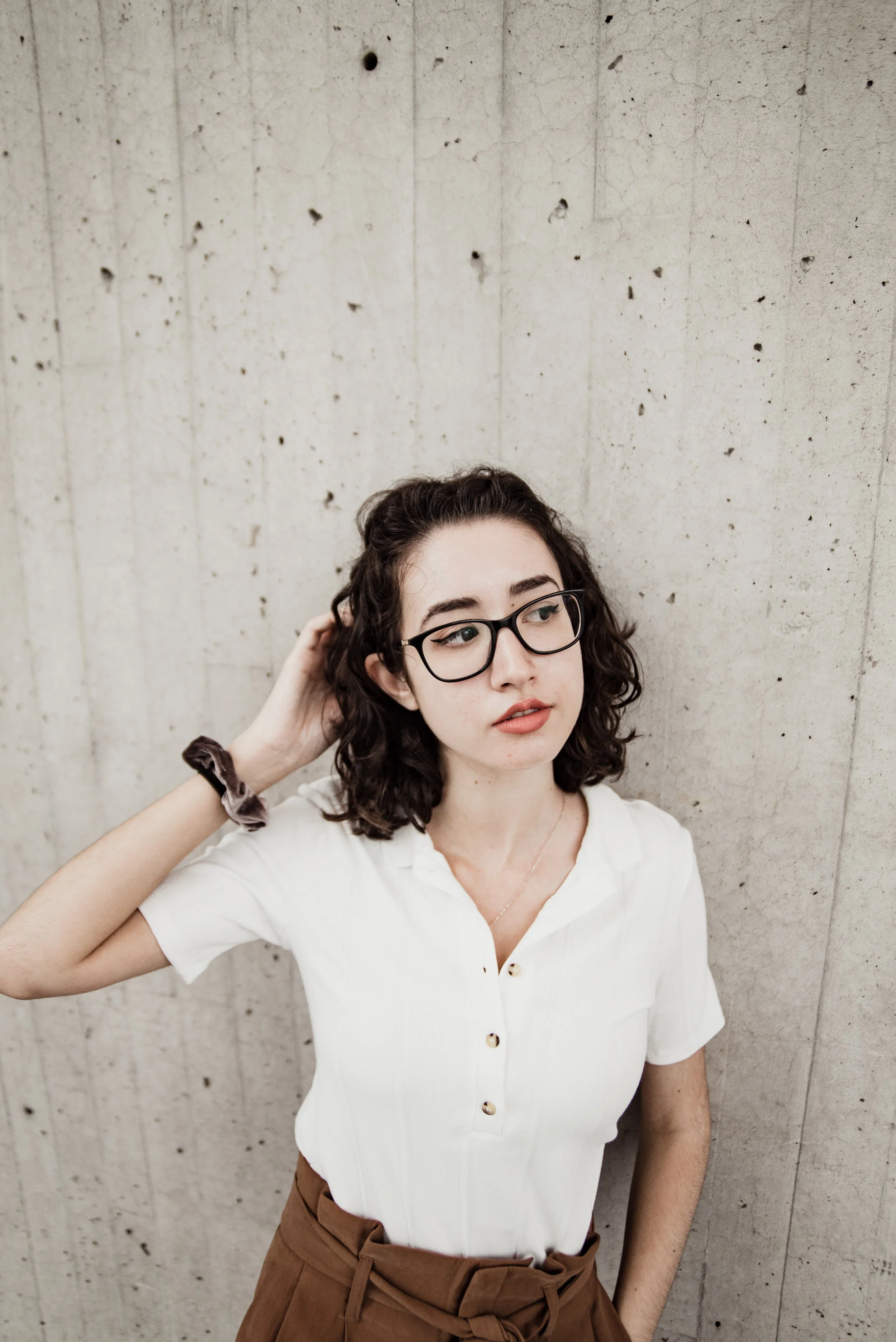 BT273-hand-in-hair-woman-white-top.jpg