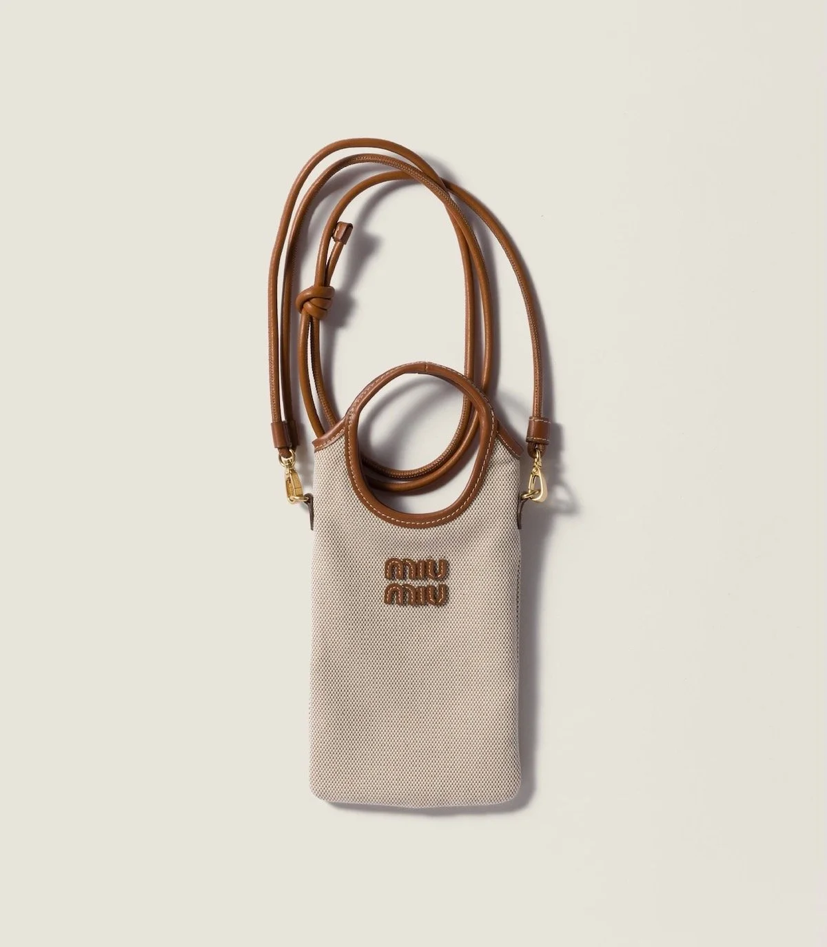 Miu Miu Canvas Smartphone Case, $1,270 at Miu Miu