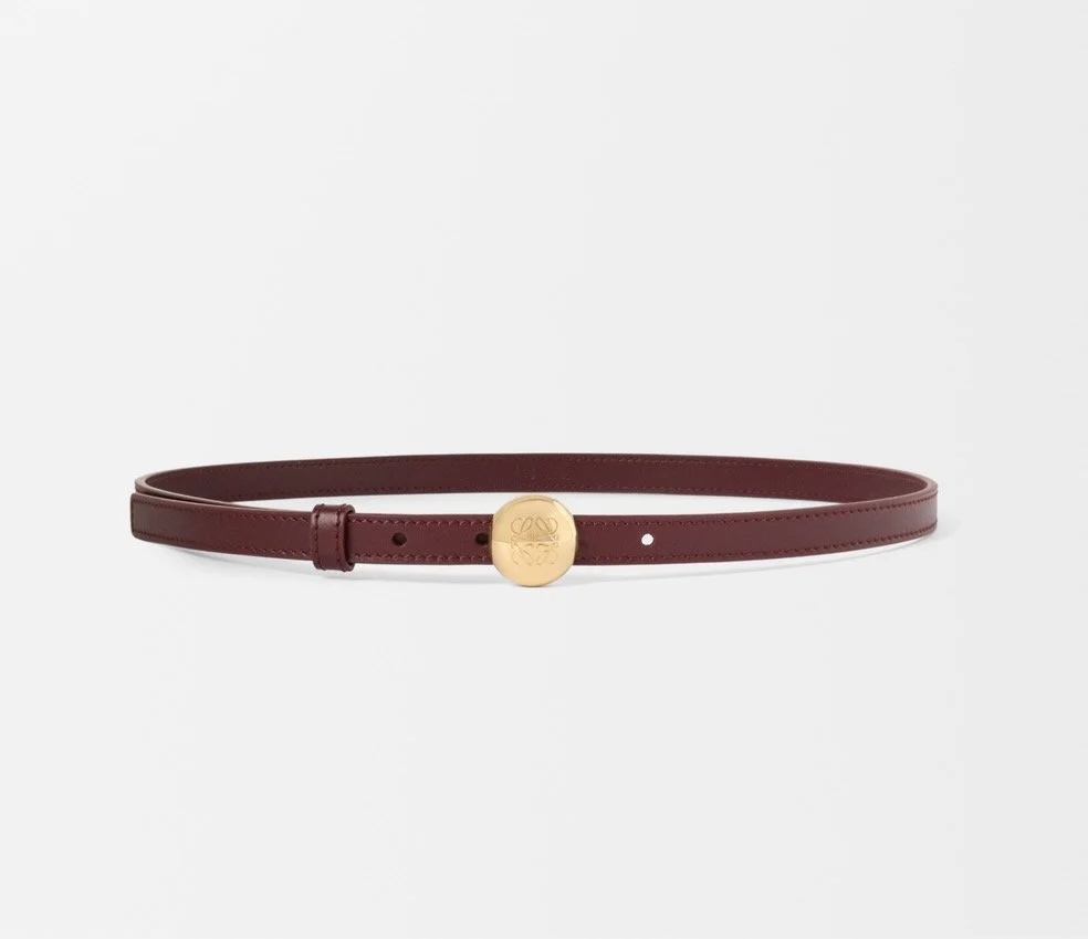 Loewe Pebble Belt in Smooth Calfskin in Dark Burgundy/Gold, $550 at Loewe