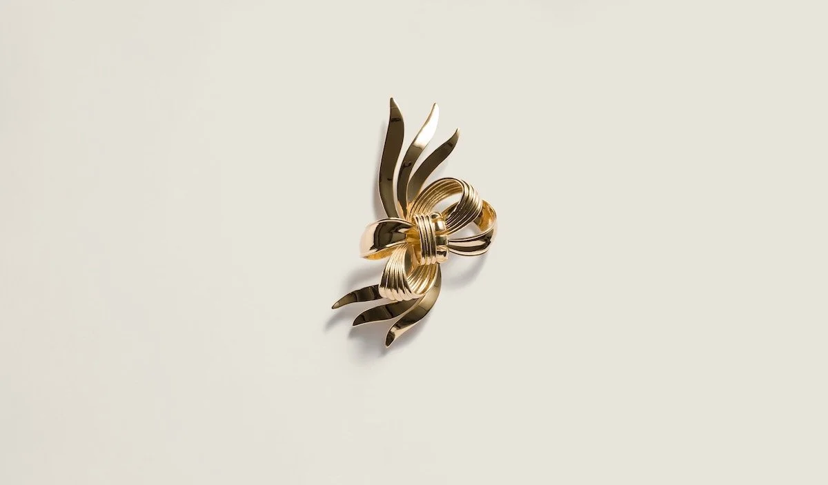 Miu Miu Metal Bow Brooch, $725 at Miu Miu