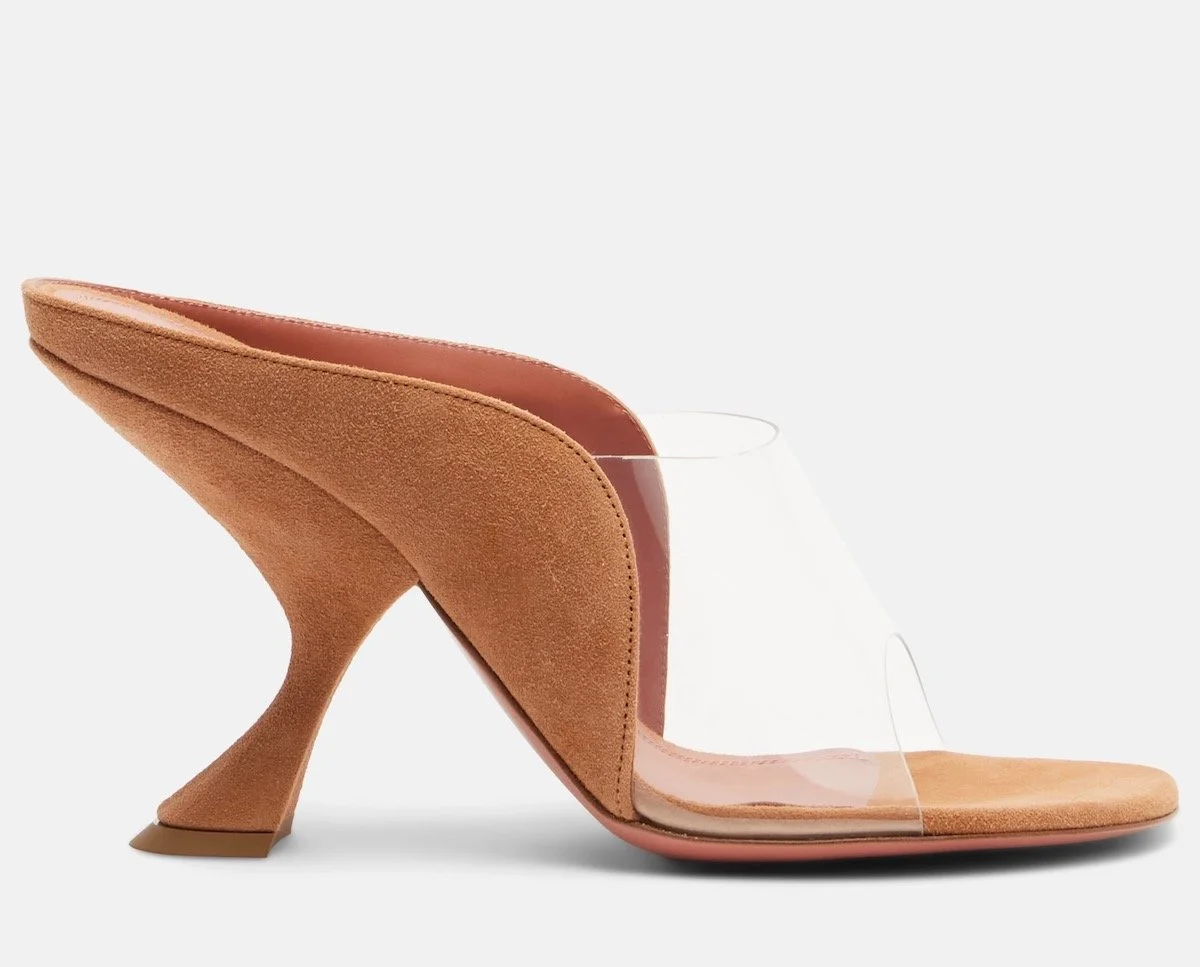 Amina Muaddi Mackenzie PVC and Suede Mules, $1,095 at Mytheresa