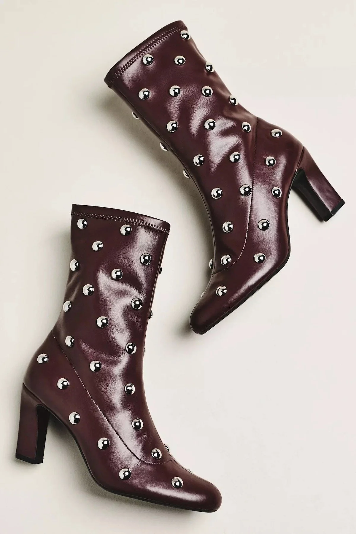 Maeve Studded Stretch Ankle Boots in Night Cherry, $198 at Anthropologie