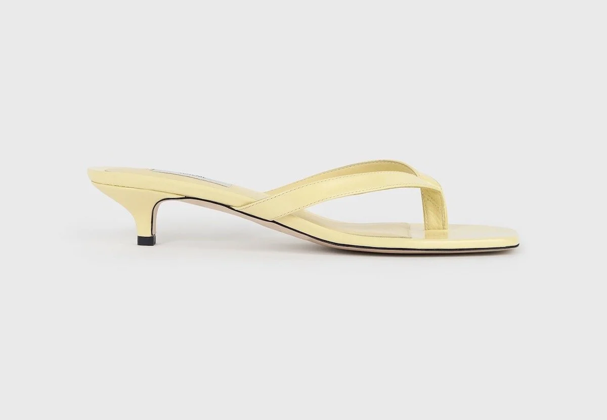 TOTEME Naplack Heeled Flip Flops Buttercup, $590 at TOTEME