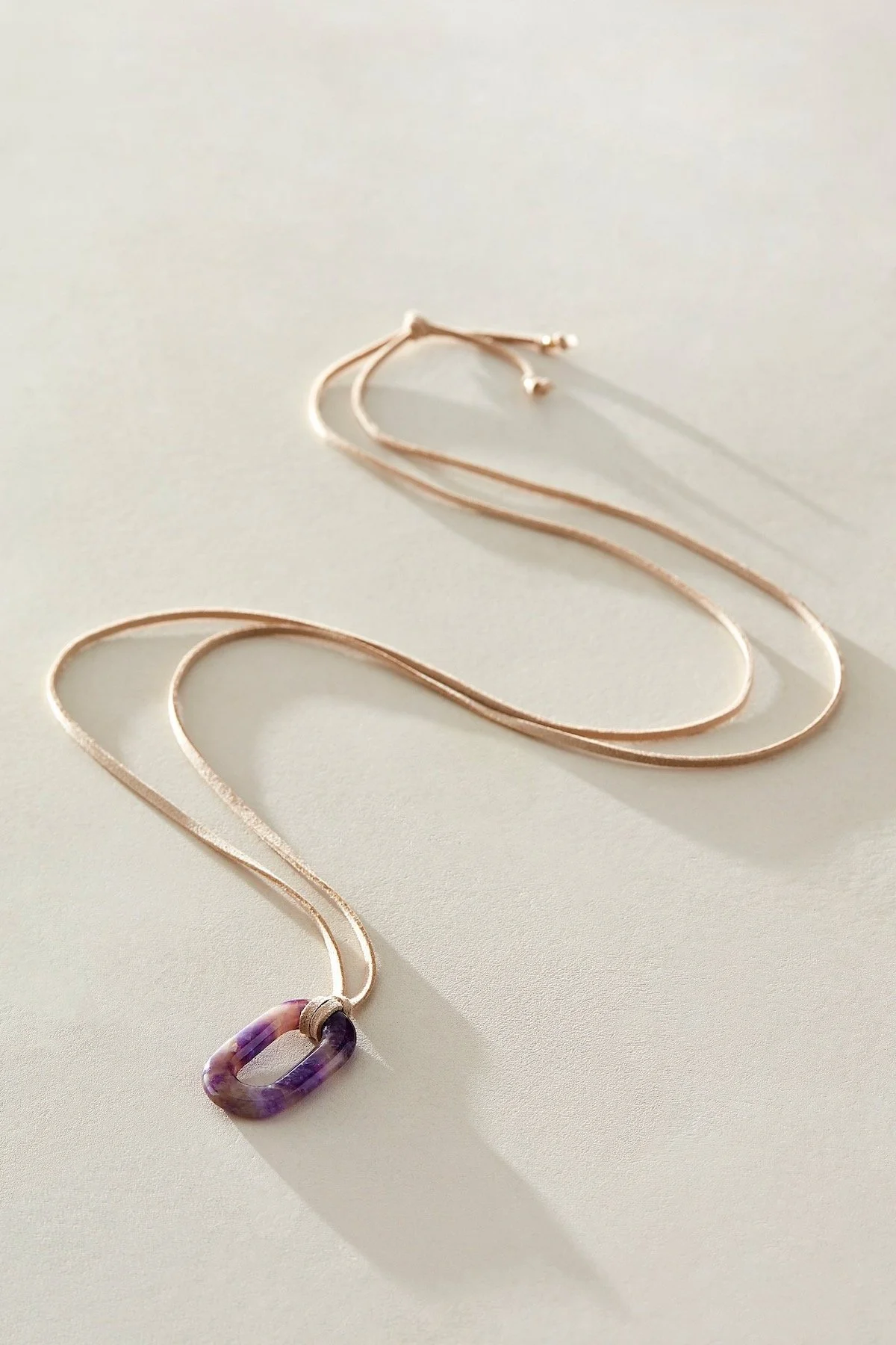 ALV Semiprecious Stone On Suede Necklace in Amethyst & Sand, $50 at Free People