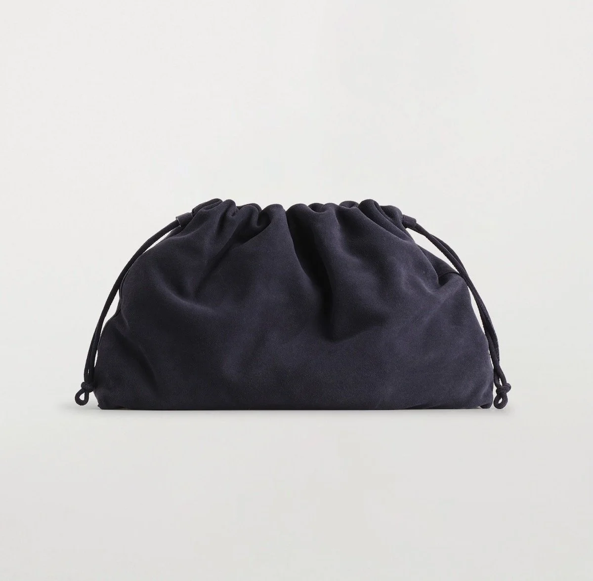 COS Cavatelli Clutch Bag in Suede in Navy, $199 at COS
