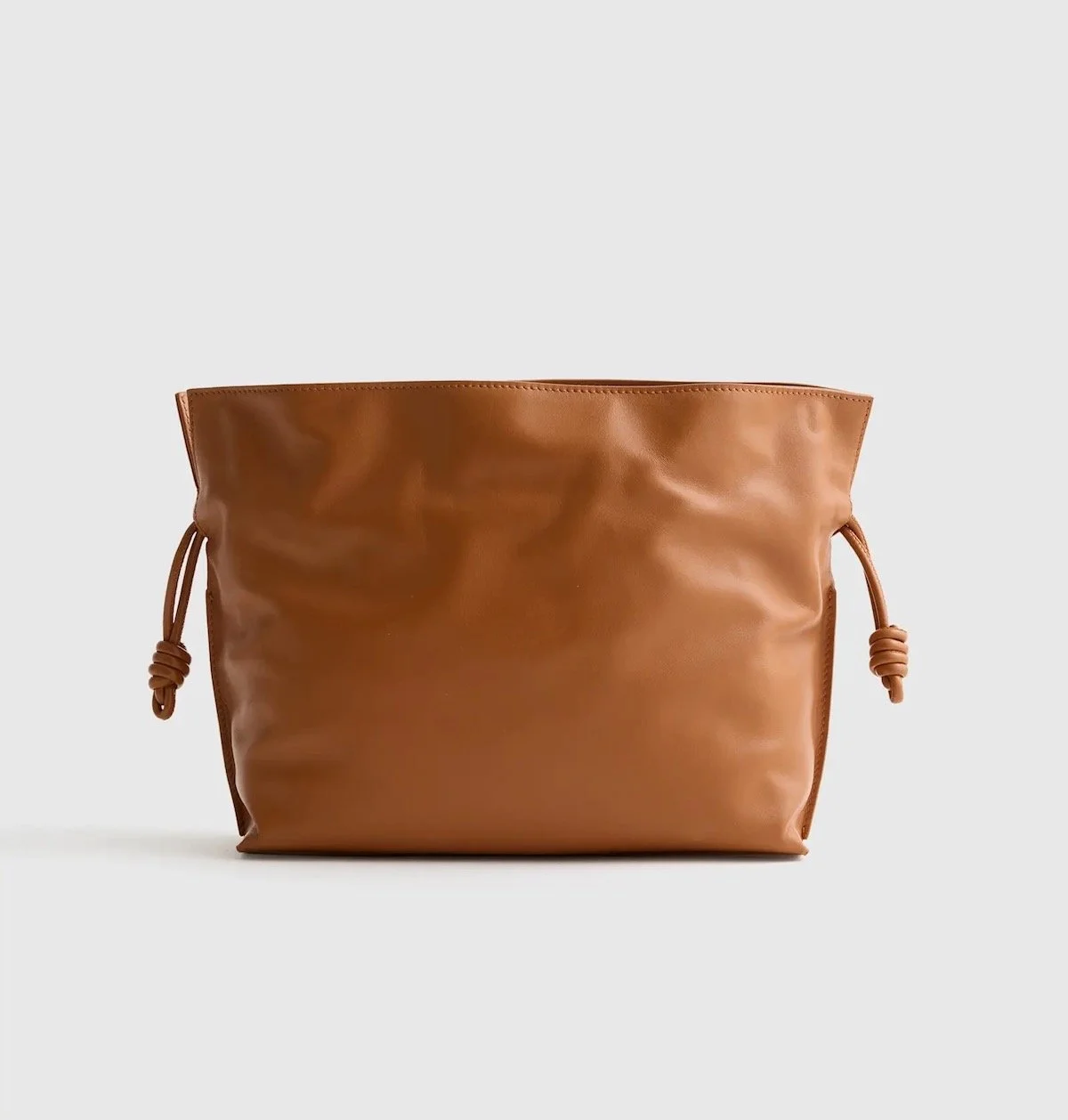 Quince Italian Leather Drawstring Pouch Crossbody in Cognac, $122 at Quince