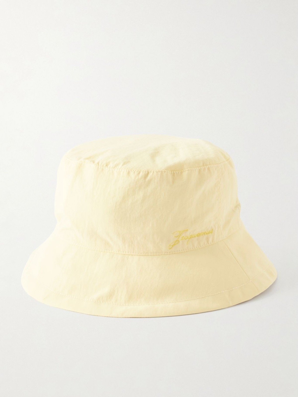 Jacquemus Le Bob Baluchon Embroidered Shell Bucket Hat in Pastel Yellow, $138 at Net-a-Porter