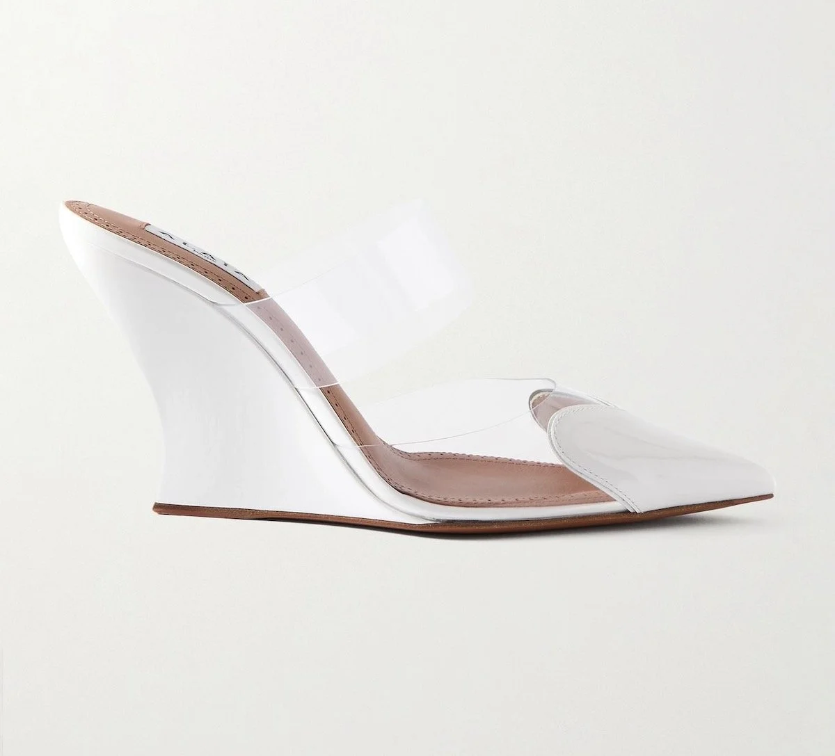 Alaia Le Cœur Patent-Leather and PVC Wedge Mules in White, $1,590 at Net-a-Porter