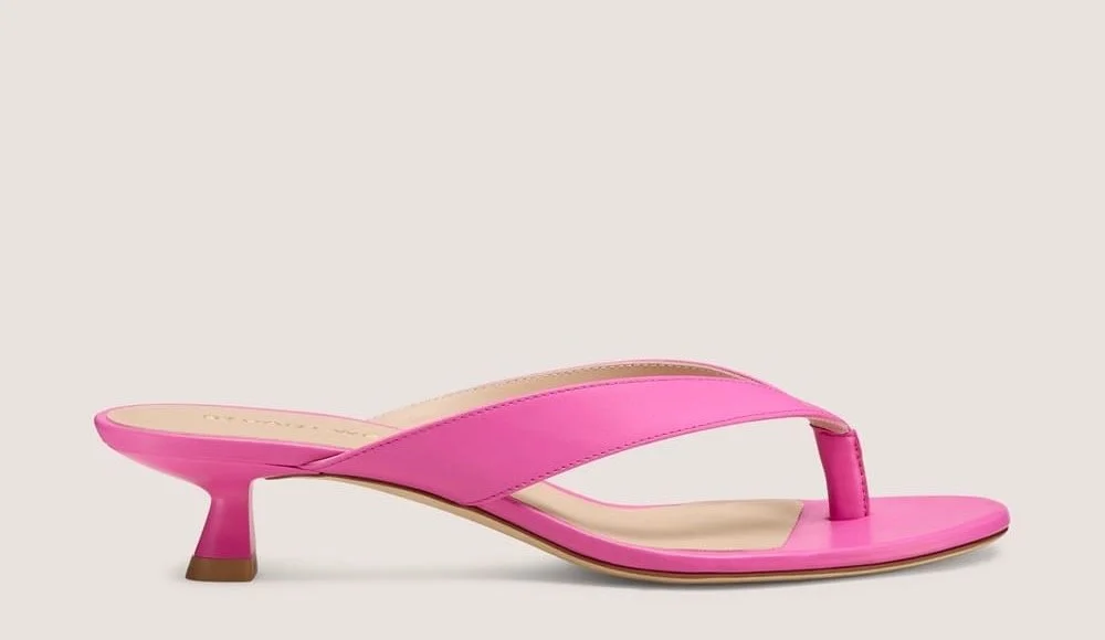 Stuart Weitzman Rio Sleek Thong Sandal 35 in Sunset Pink Leather, $395 at Stuart Weitzman