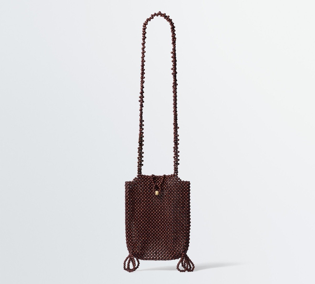 LEMAIRE Grigri Phone Holder in Wooden Beads, $1,360 at LEMAIRE