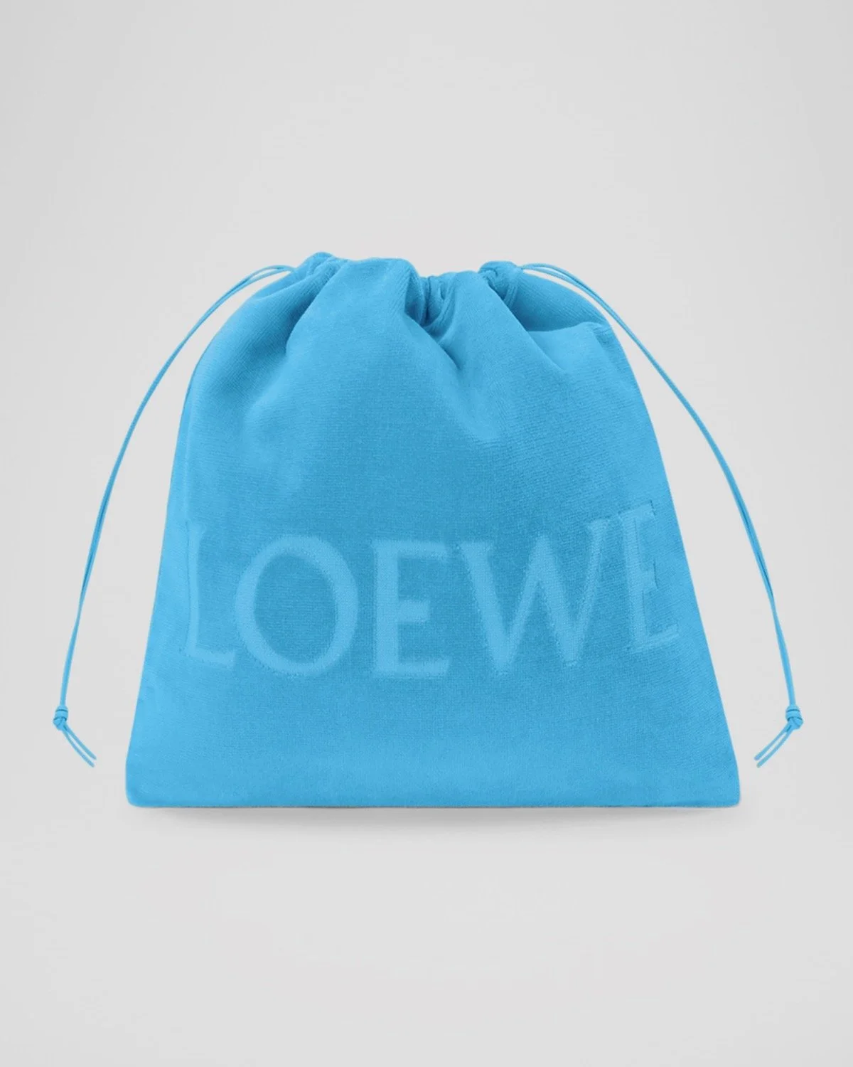Loewe x Paula’s Ibiza Medium Drawstring Pouch Bag in Terry Cloth in Light Blue, $550 at Neiman Marcus