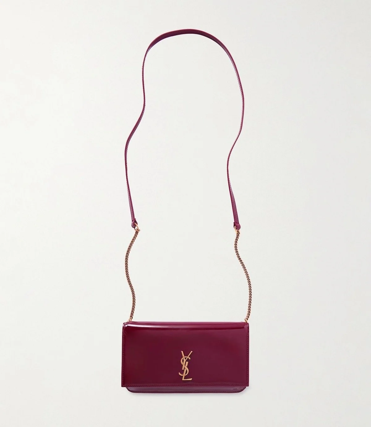 Saint Laurent Cassandre Strap Patent-Leather Phone Case in Burgundy, $850 at Net-a-Porter
