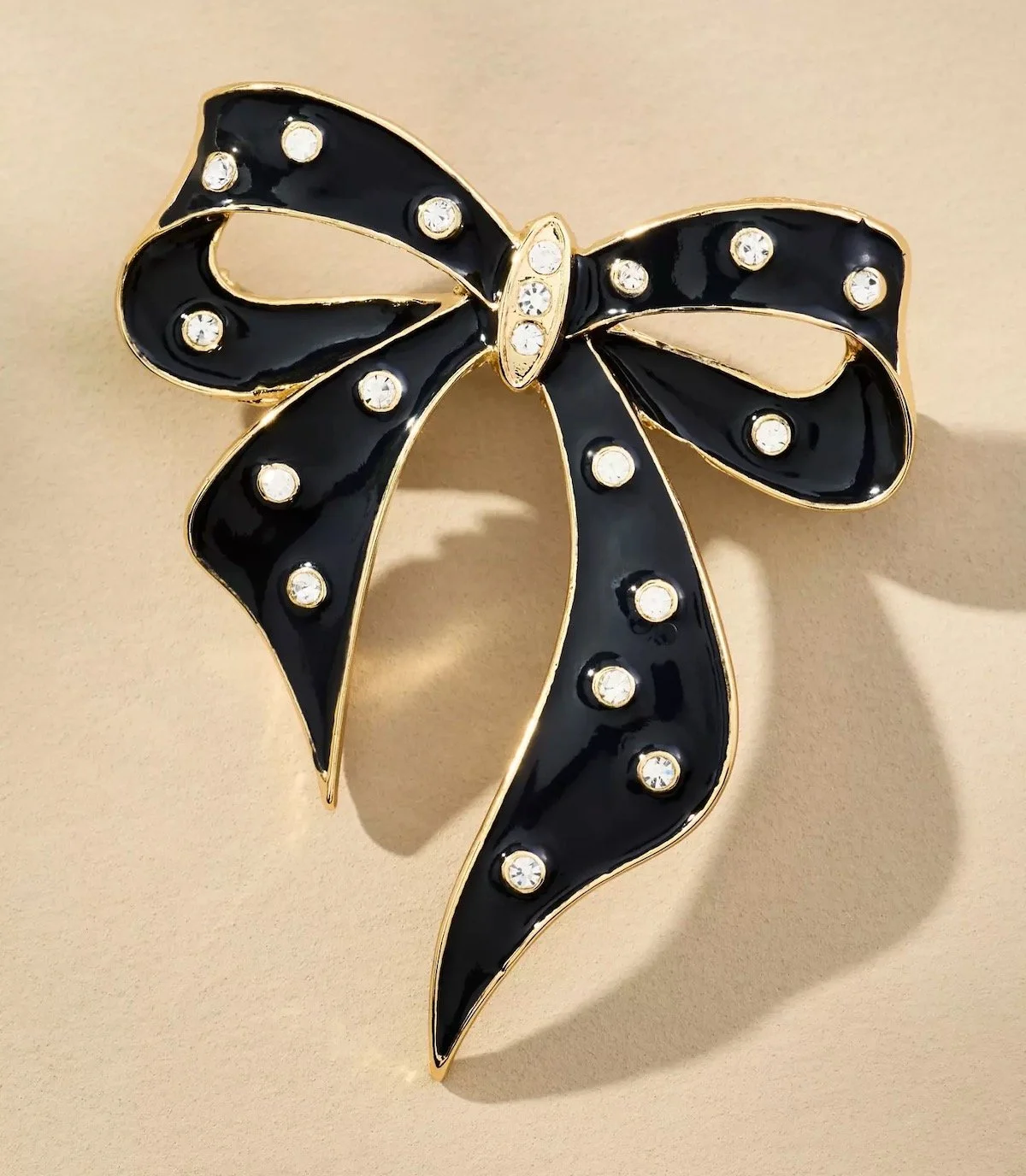 By Anthropologie Crystal Bow Brooch in Black, $38 at Anthropologie