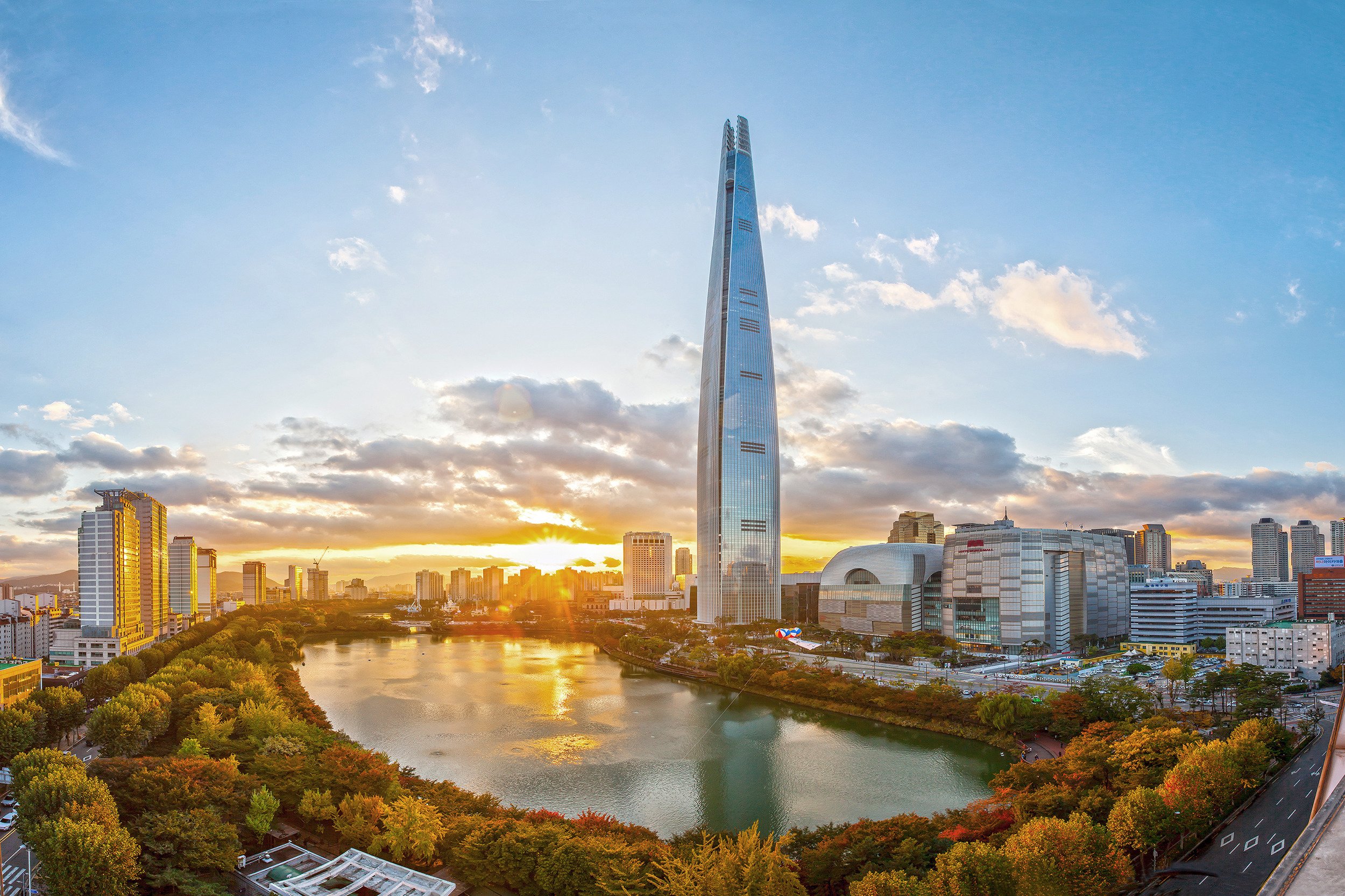 Lotte World Tower—one of the tallest buildings in the world, overlooking Seokchon Lake, which is especially beautiful in autumn with its stunning fall foliage.