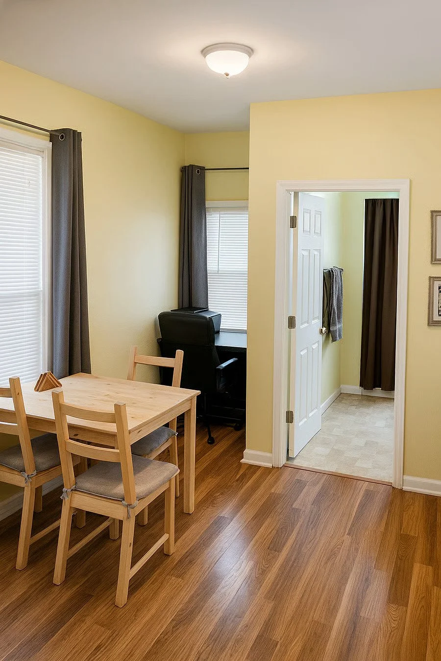 Dedicated dining area with seating for meals, and a desk for remote work or late charting.