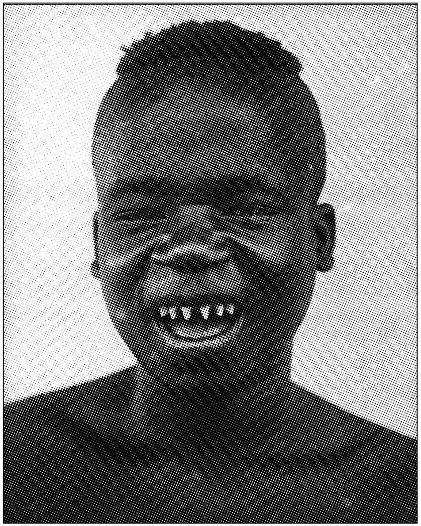Black and white pixelated portrait of a smiling person with exaggerated facial features, showing small eyes, a wide nose, and large mouth with crooked teeth.