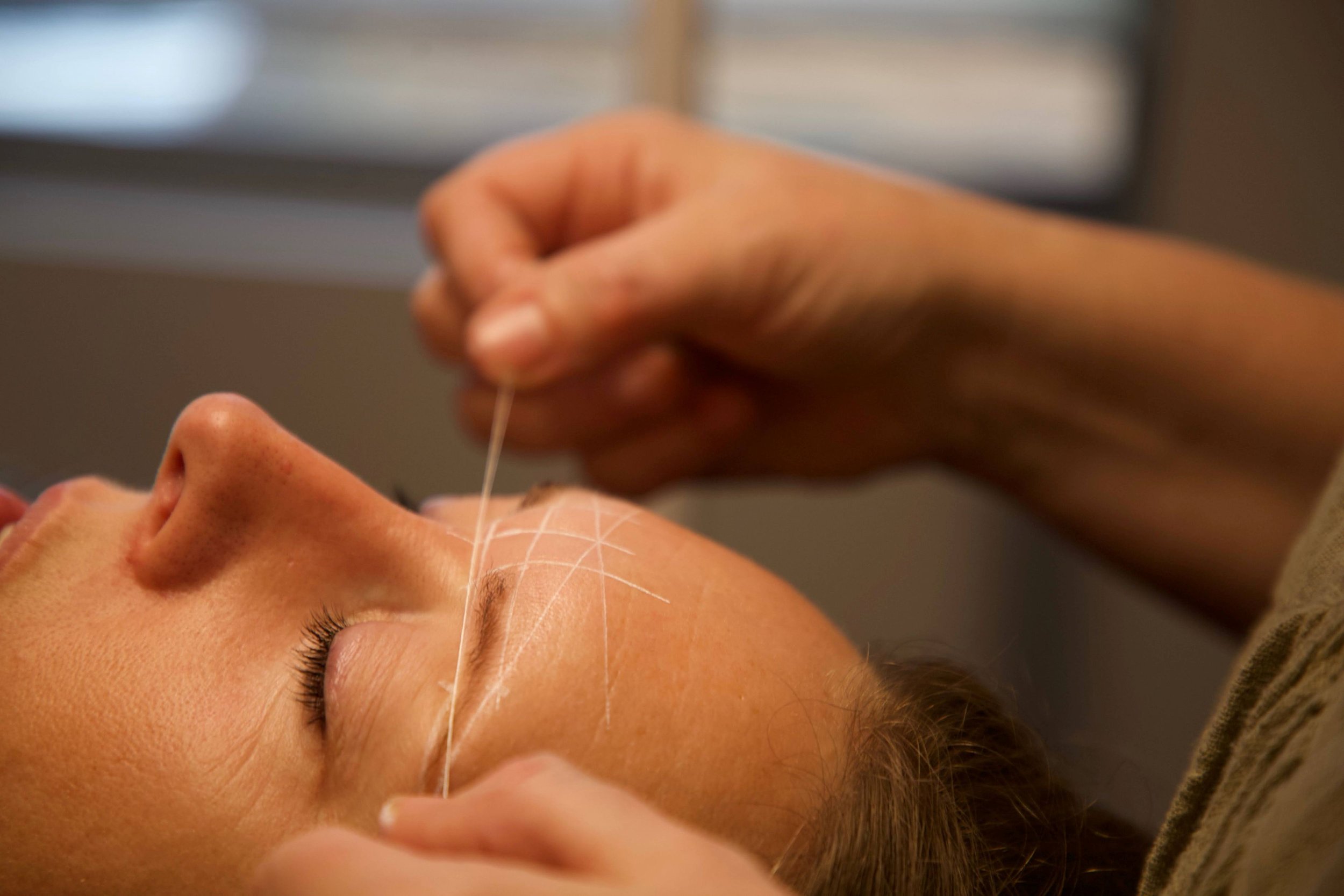A woman having her brows mapped for waxing and shaping at The Beauty Room Denmark.jpg