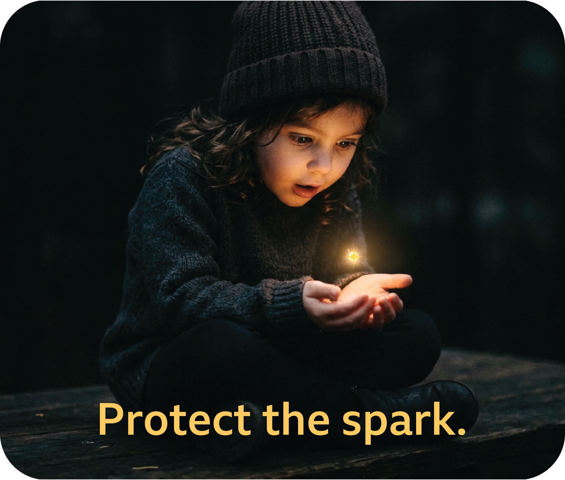Child looking at a spark of light in their hand.  Underneath the child, it reads "protect the spark."