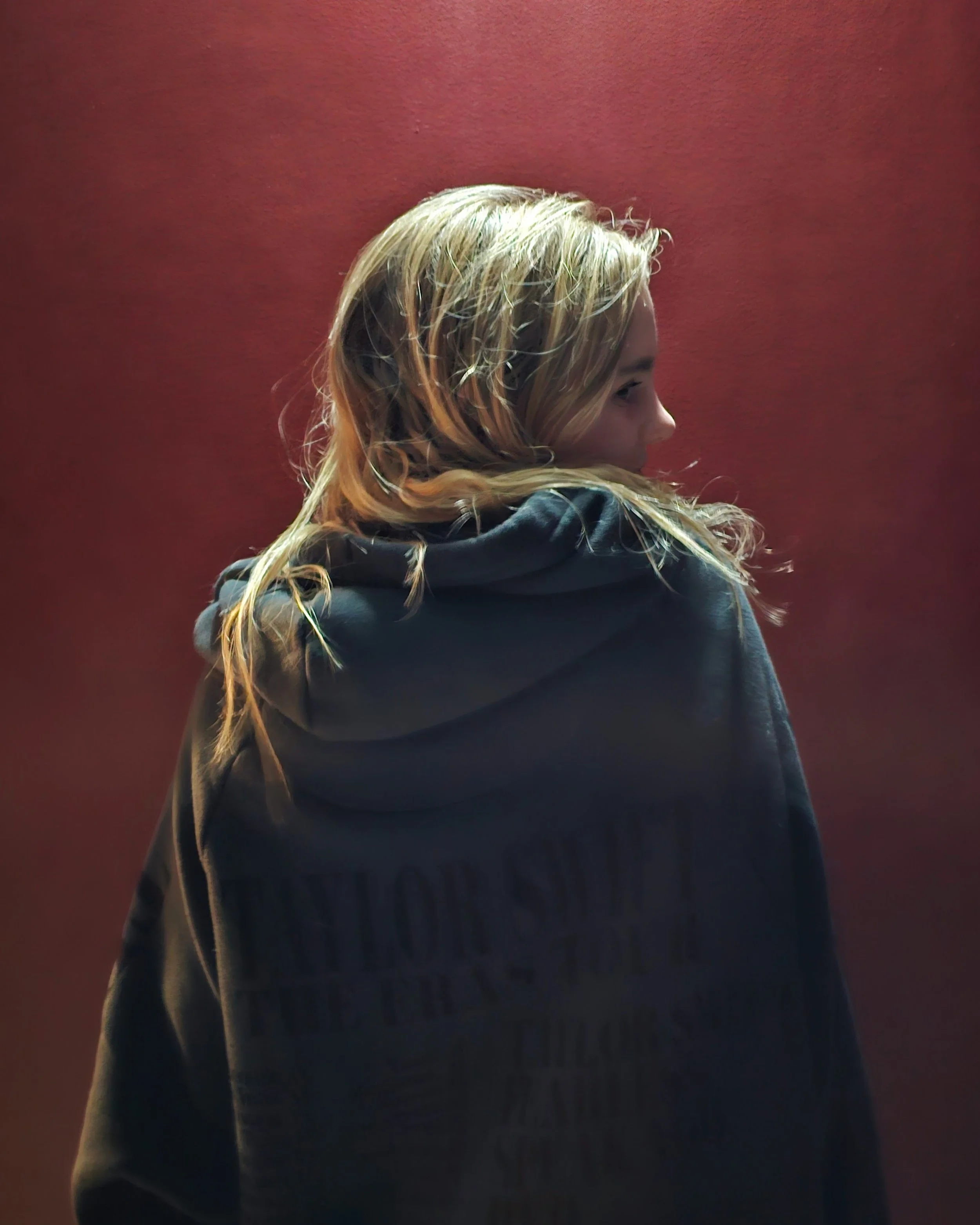 Young natural beauty, blonde hair, wearing Taylor Swift merchandise.