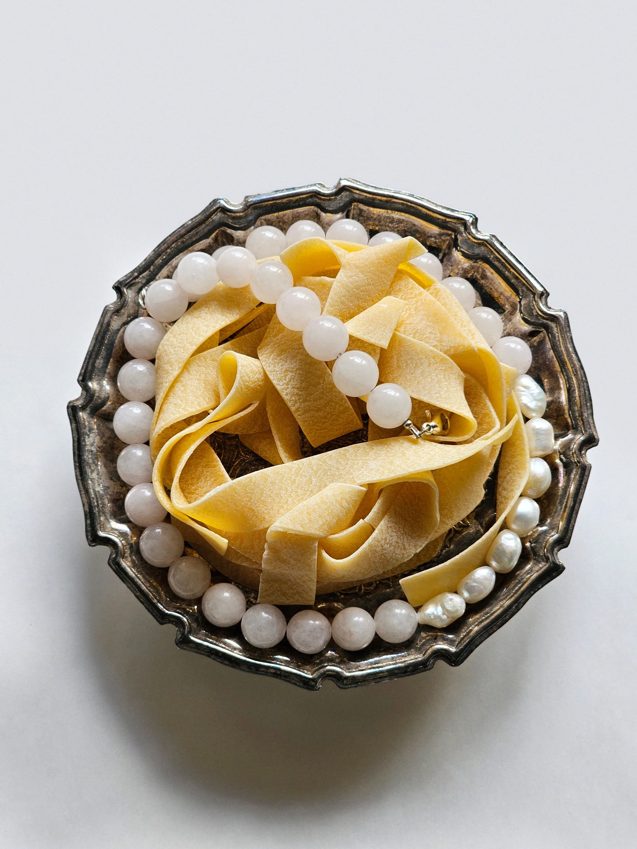 glass beads and pearls with pasta