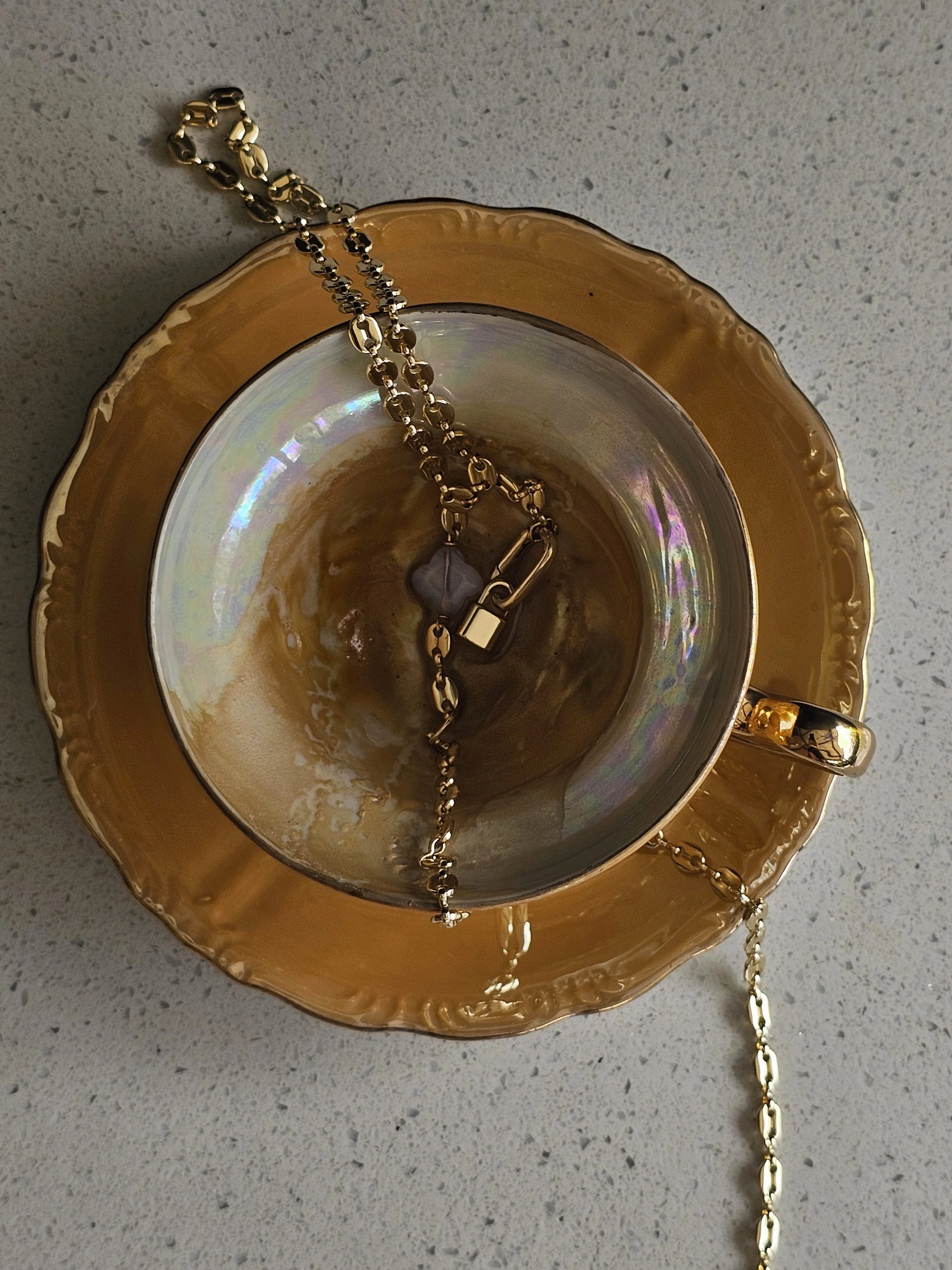 Coffee and gold necklace