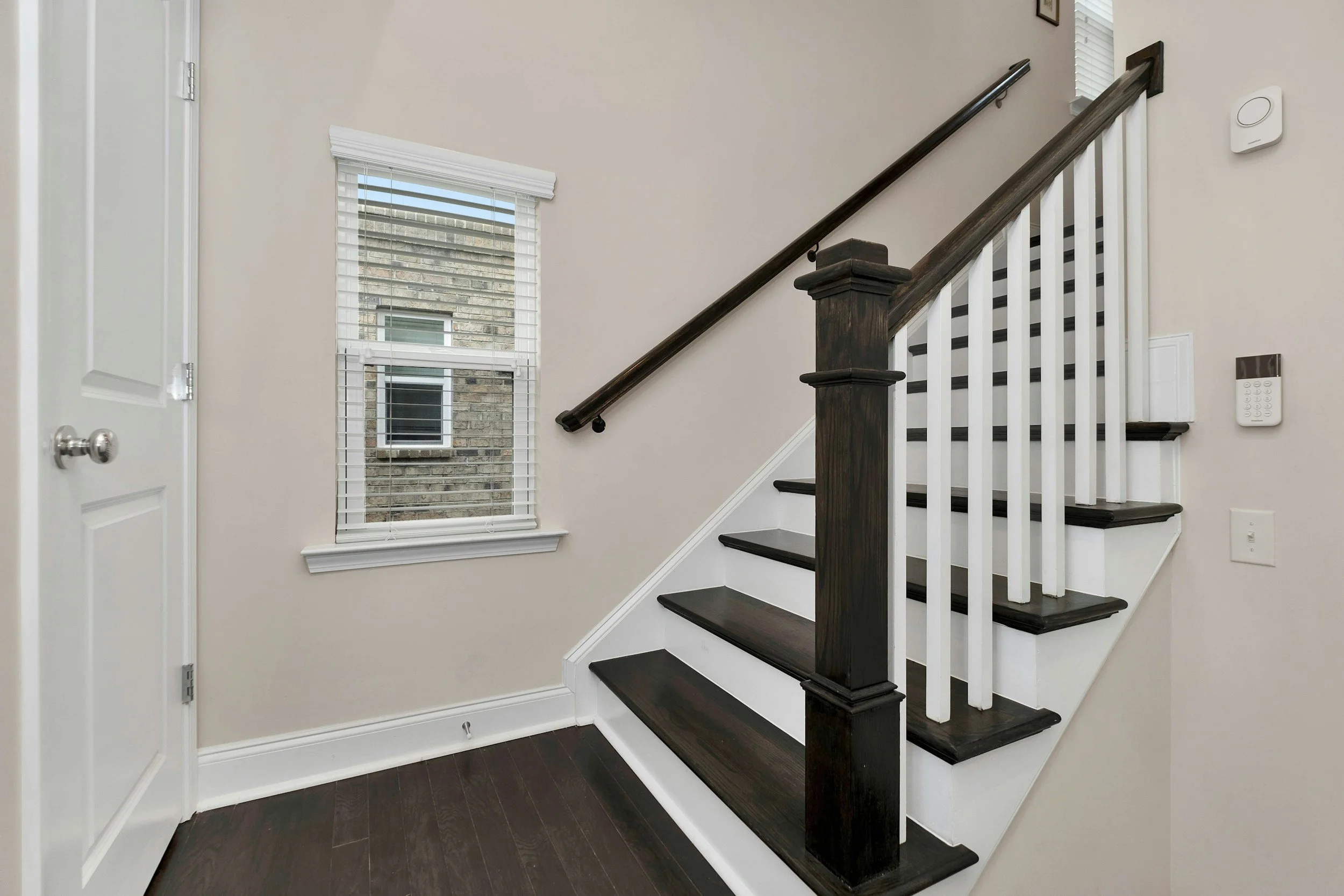 Interior staircase with sharp trim detailing and timber steps – professional painting service Newcastle