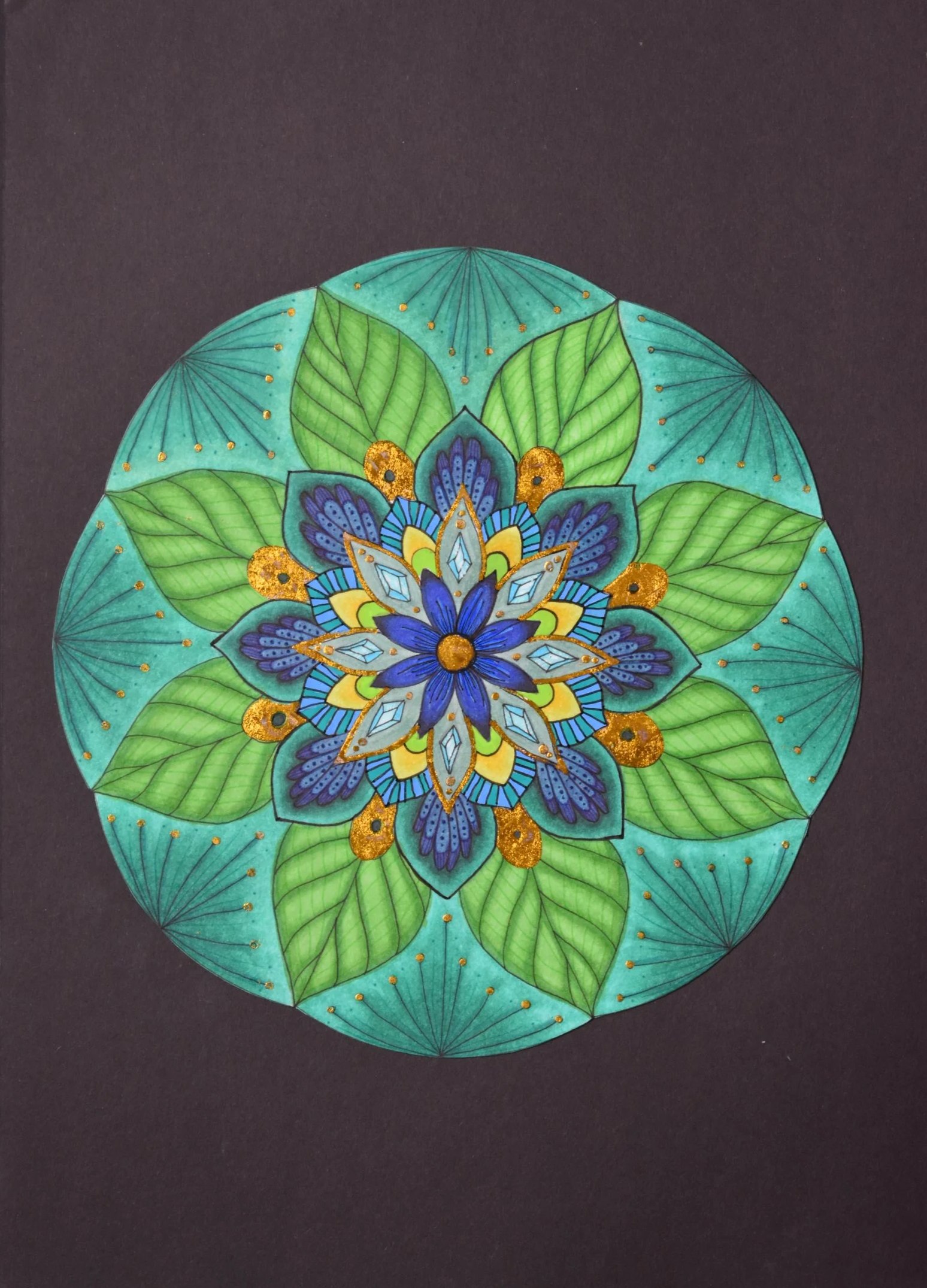 Colored mandala - I think this one came out well, I was so used to the black and white that I wanted to step out my comfort zone and use color.
I used black and colored fine liners, alcohol and acrylic markers and gold-ish leaf.