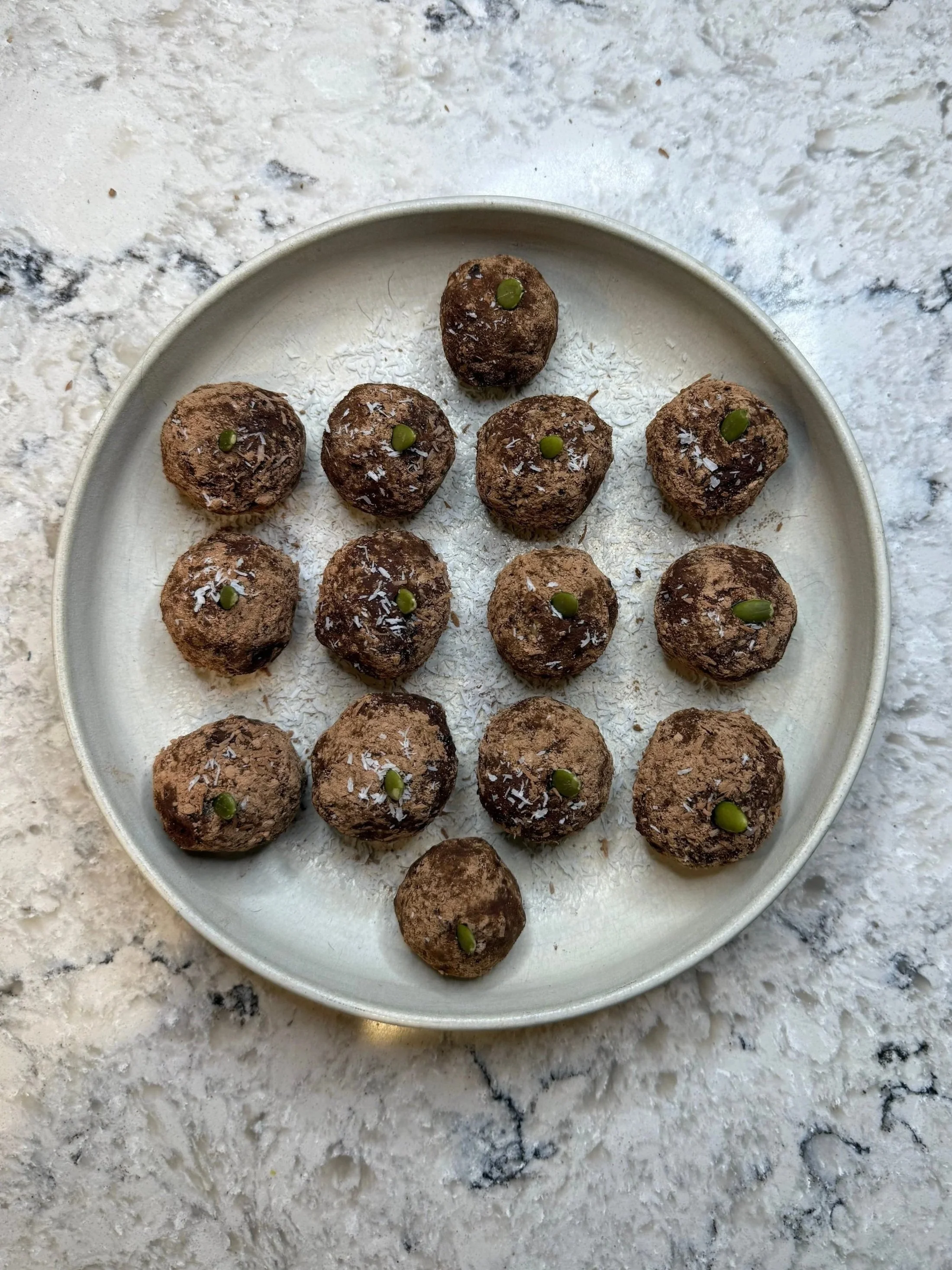 a bowl of healthy, plant-based chocolate truffles made from adzuki beans