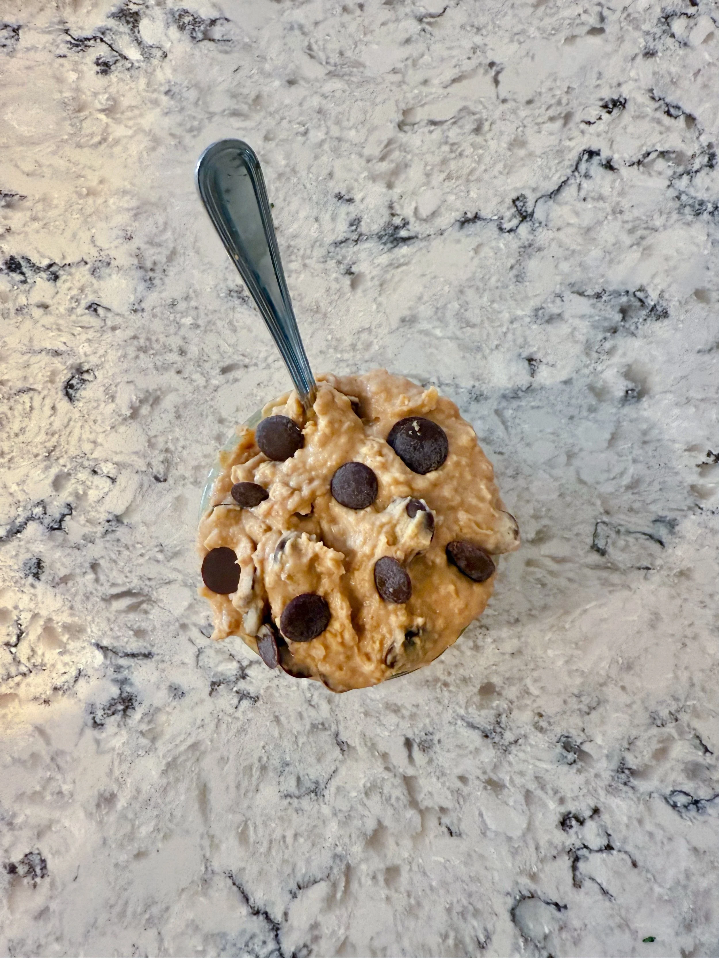 High-protein, plant-based, edible chocolate chip cookie dough made from white beans, specifically navy beans.