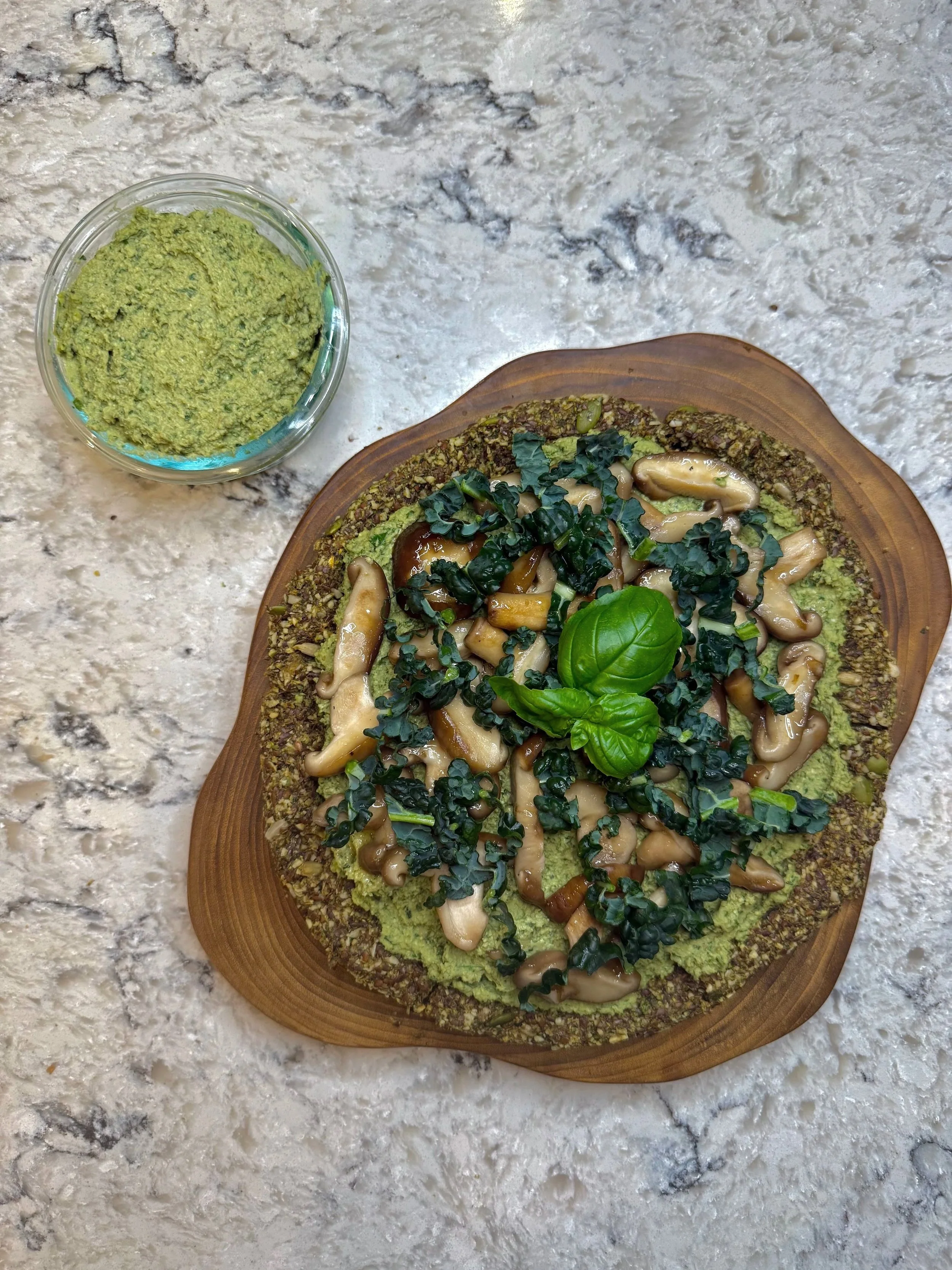 Creamy vegan white bean pesto made with basil and parsley, served on toast with mushrooms and greens