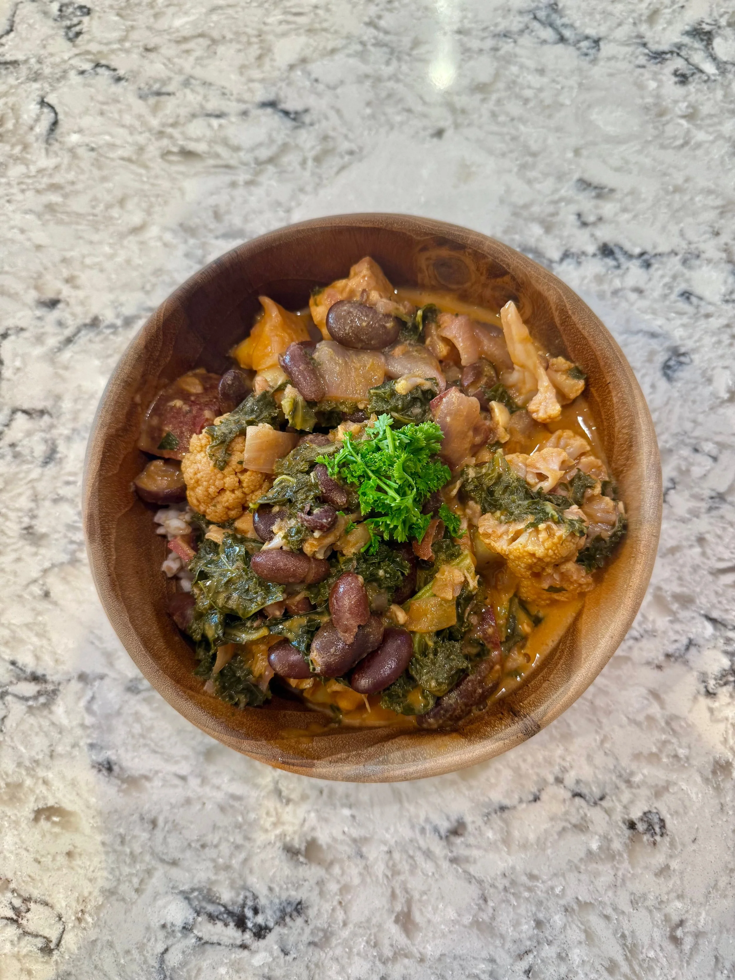 this is a bowl of tempeh curry with beans