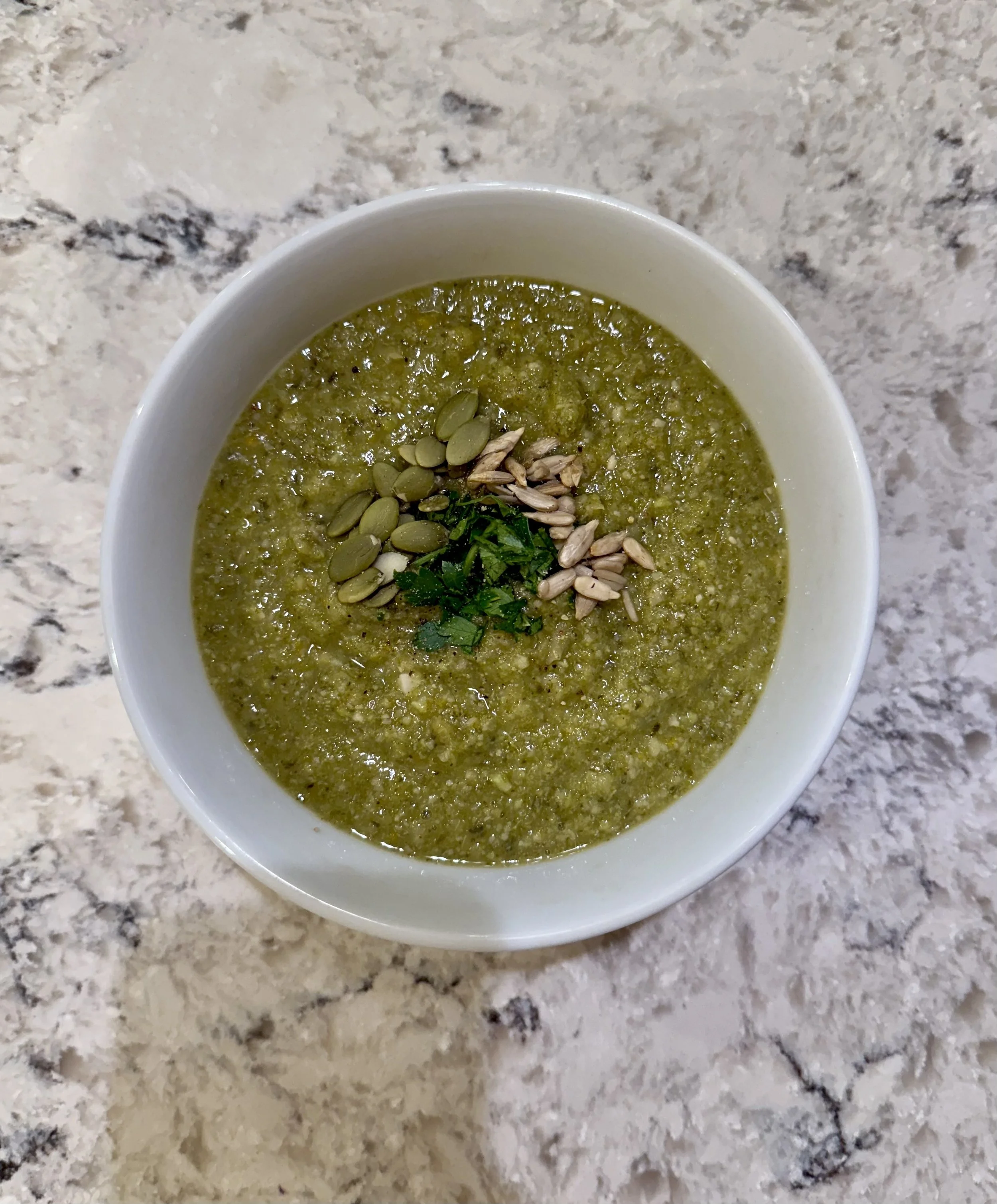 A bowl of plant-based, creamy broccoli and white bean soup.