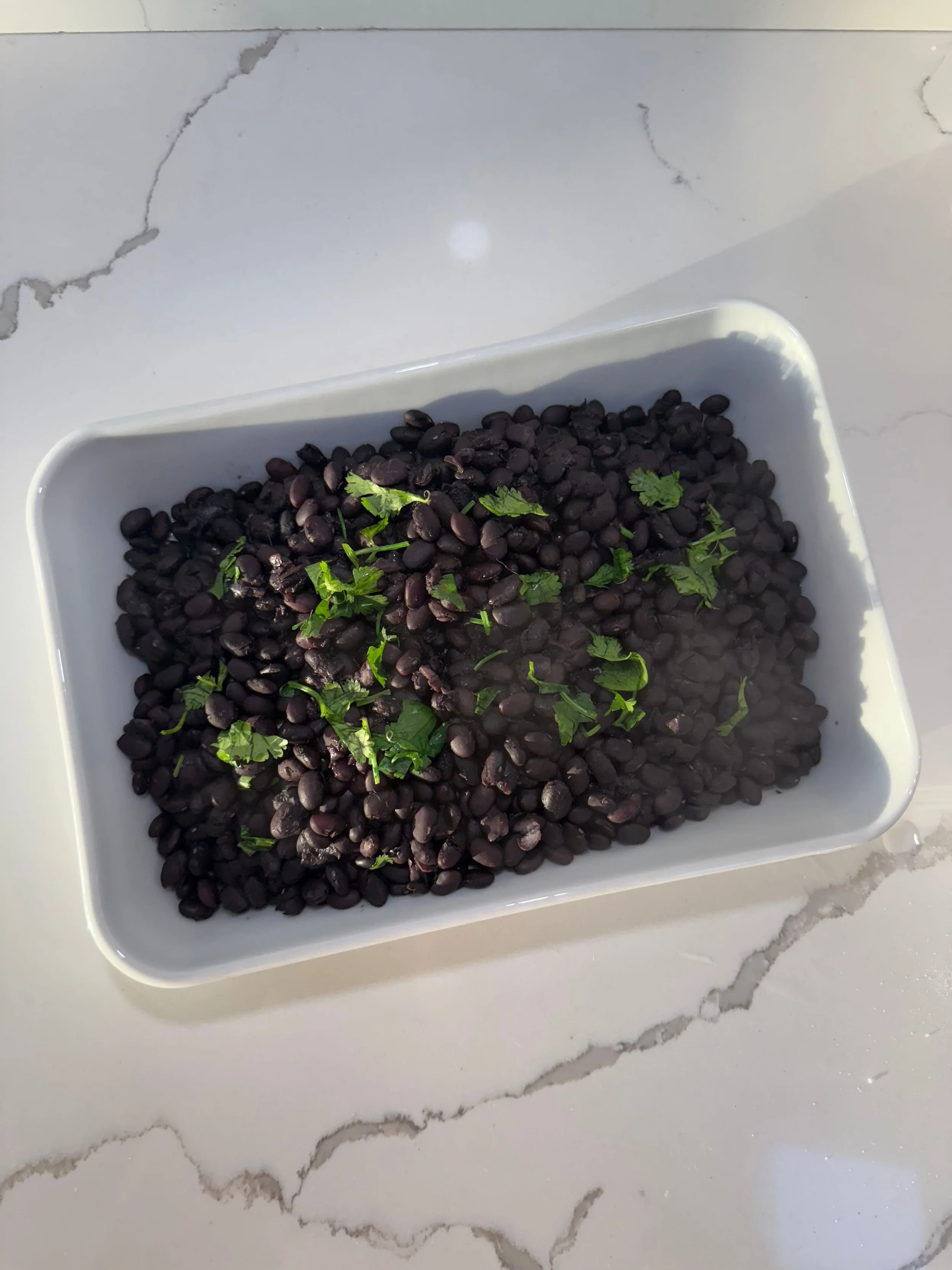 a bowl of black beans cooked from dry beans using the stovetop method