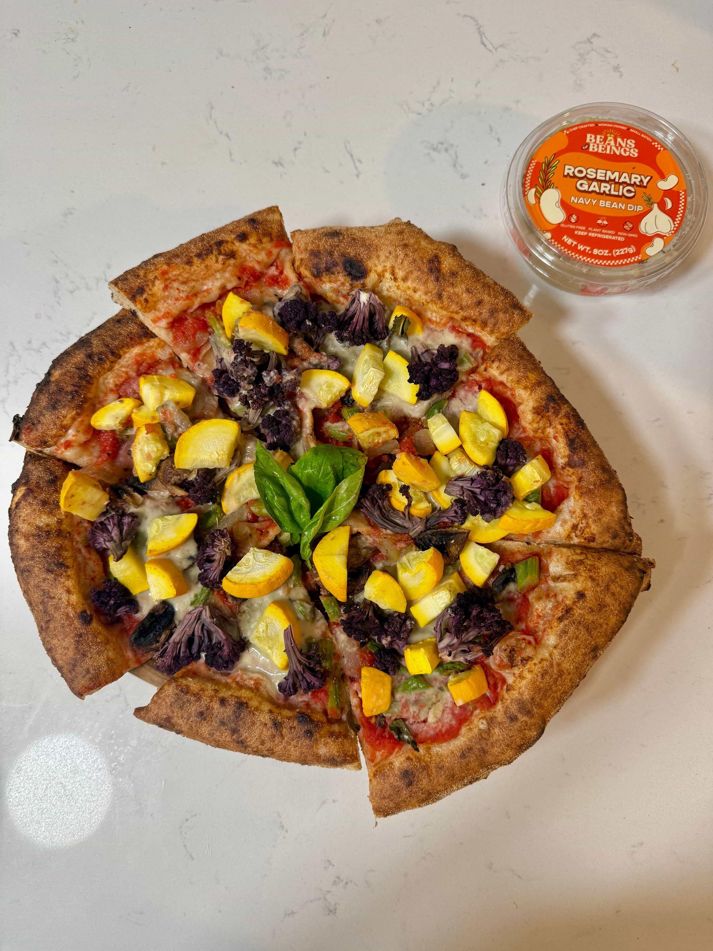 an image of pizza with bean dip