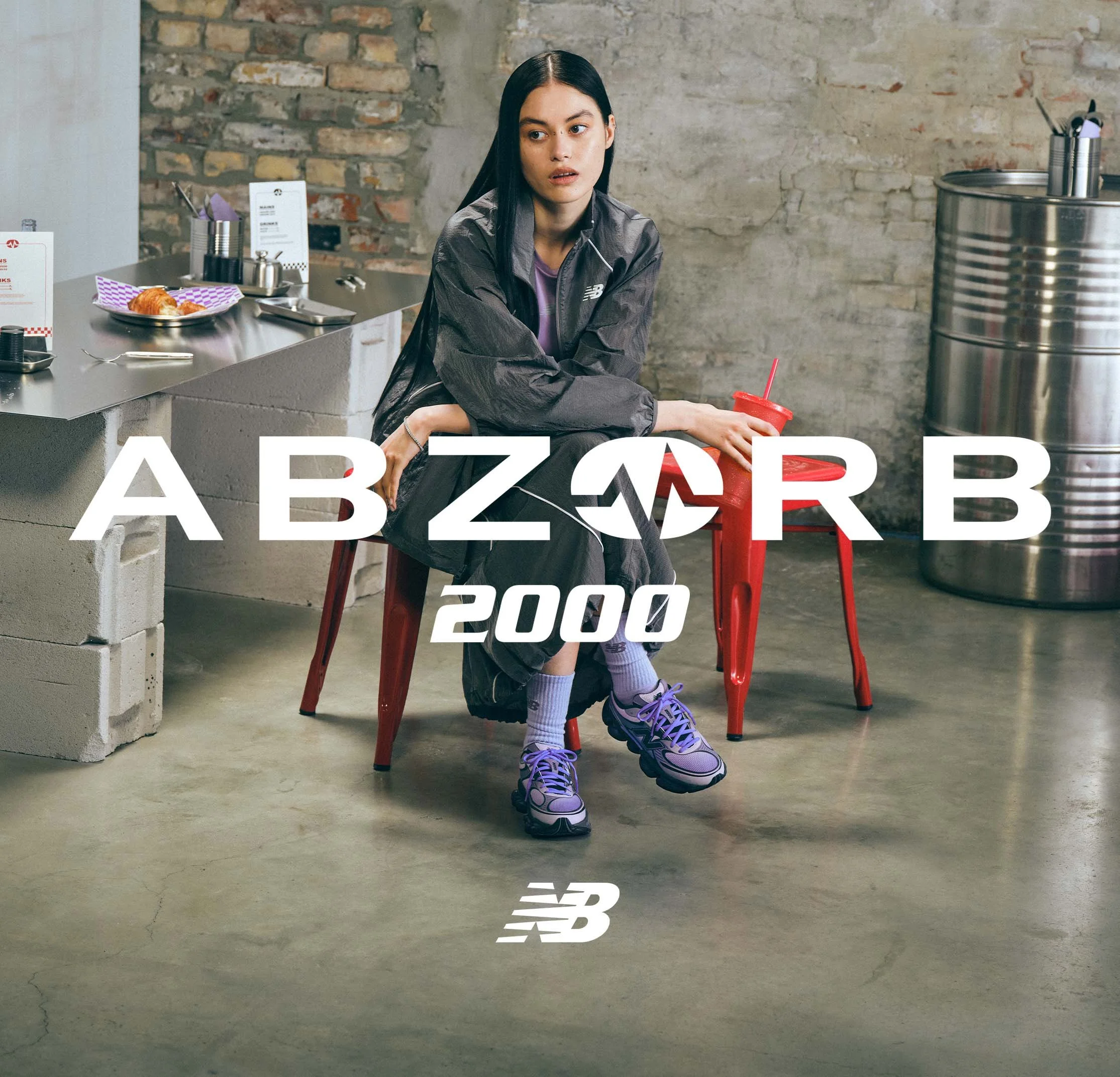 Female model wears Abzorb 2000 New Balance sneakers