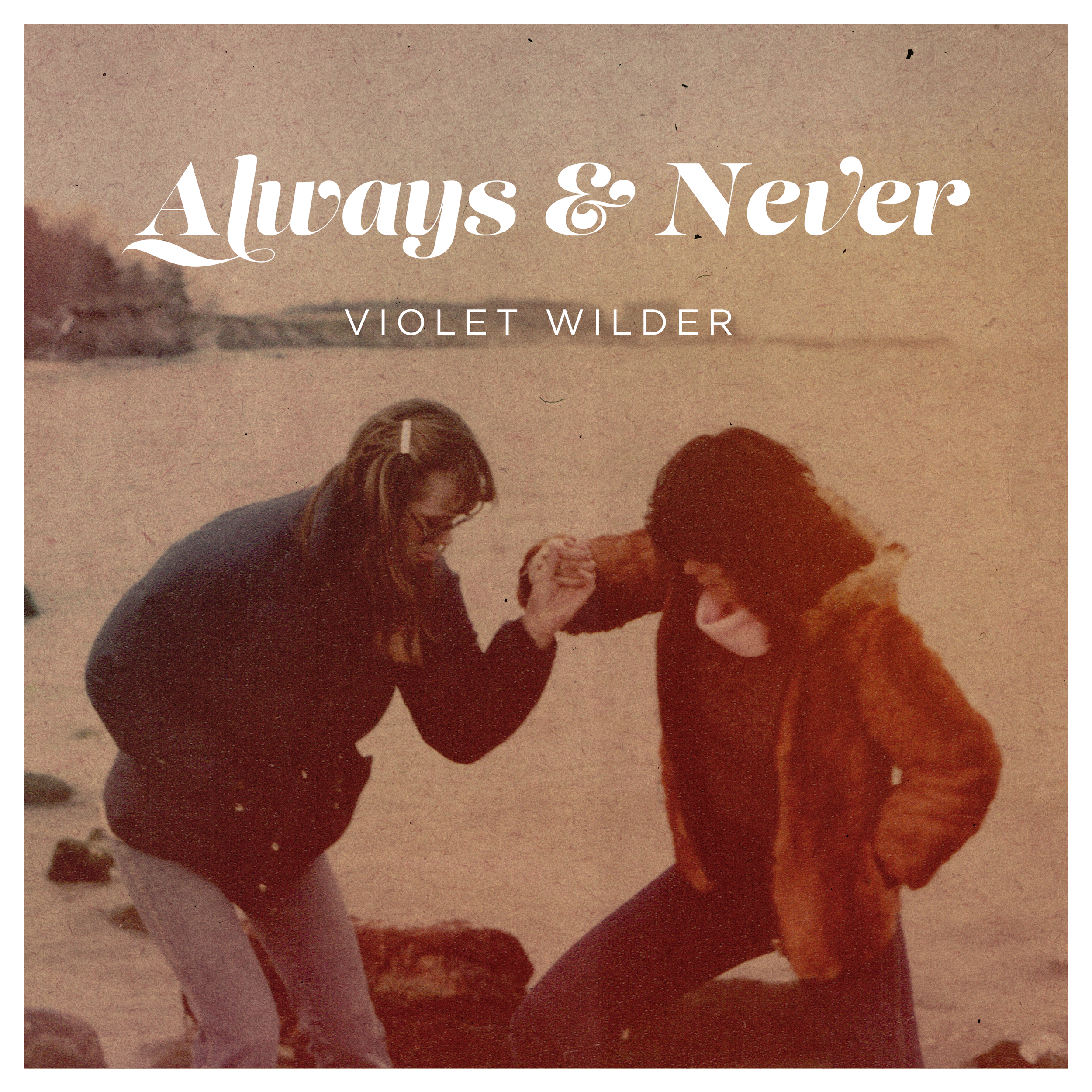 Two women on a beach, one helping the other stand up, with a sunset in the background, illustrating a moment of friendship and support.