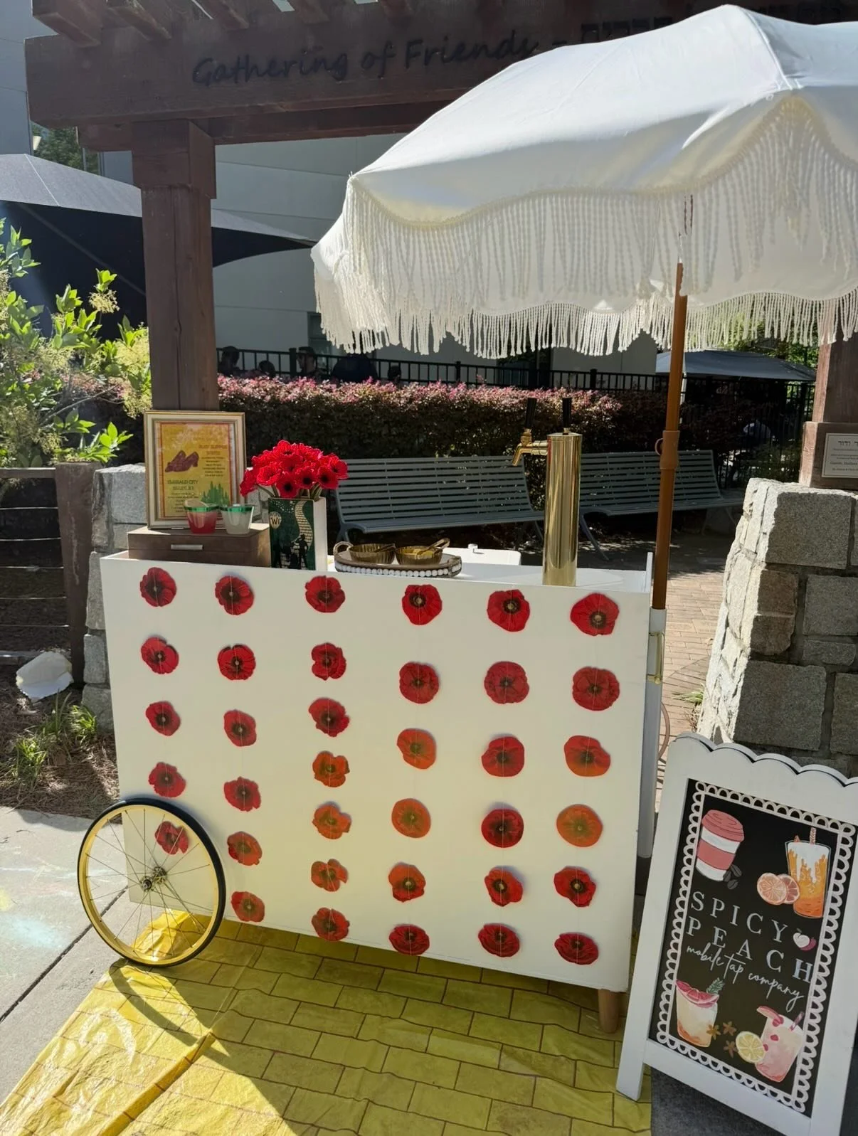 If lost, simply follow the Yellow Brick Road 🌼💛

Carnival games for the kids and Miss Peach for the adults! Serving up a delicious Ruby Slipper Spritz and an Emerald City Sparkler 👠💚

We had the best time at the @templesinaiatlanta  Preschool Fun