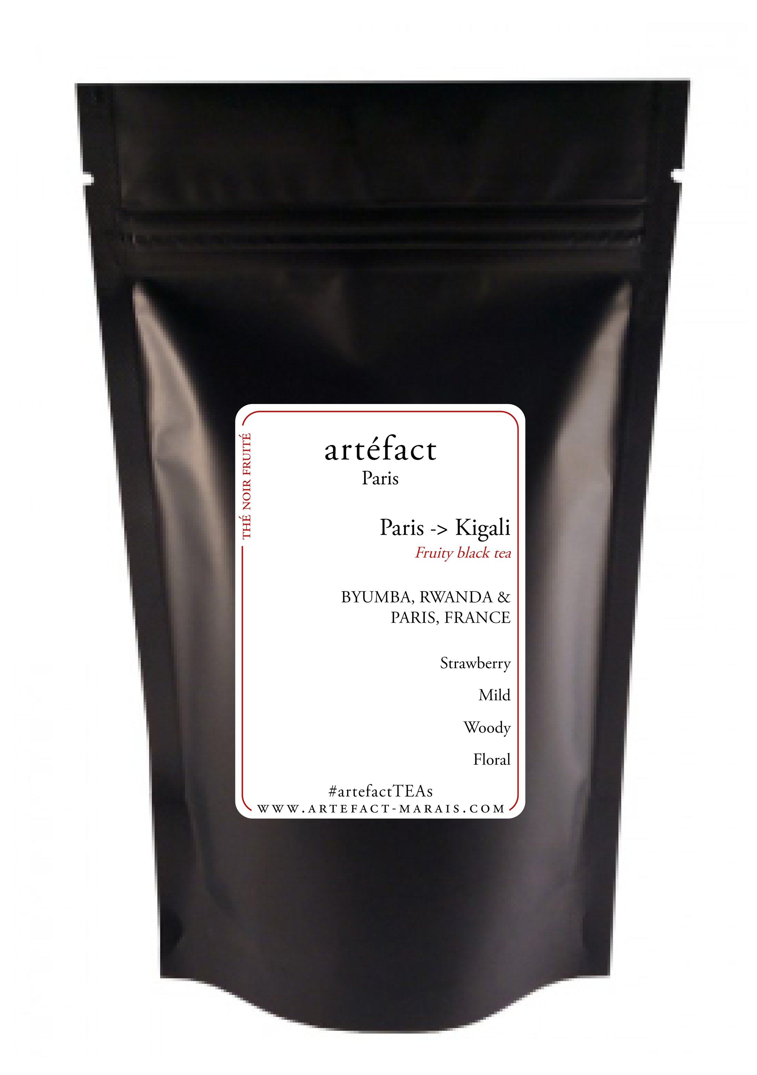 Black resealable pouch of artisanal black tea from Paris with a white label indicating it is for a tea journey from Paris to Kigali, with flavor notes of strawberry, mild, woody, and floral, and the brand website artefact-marais.com.