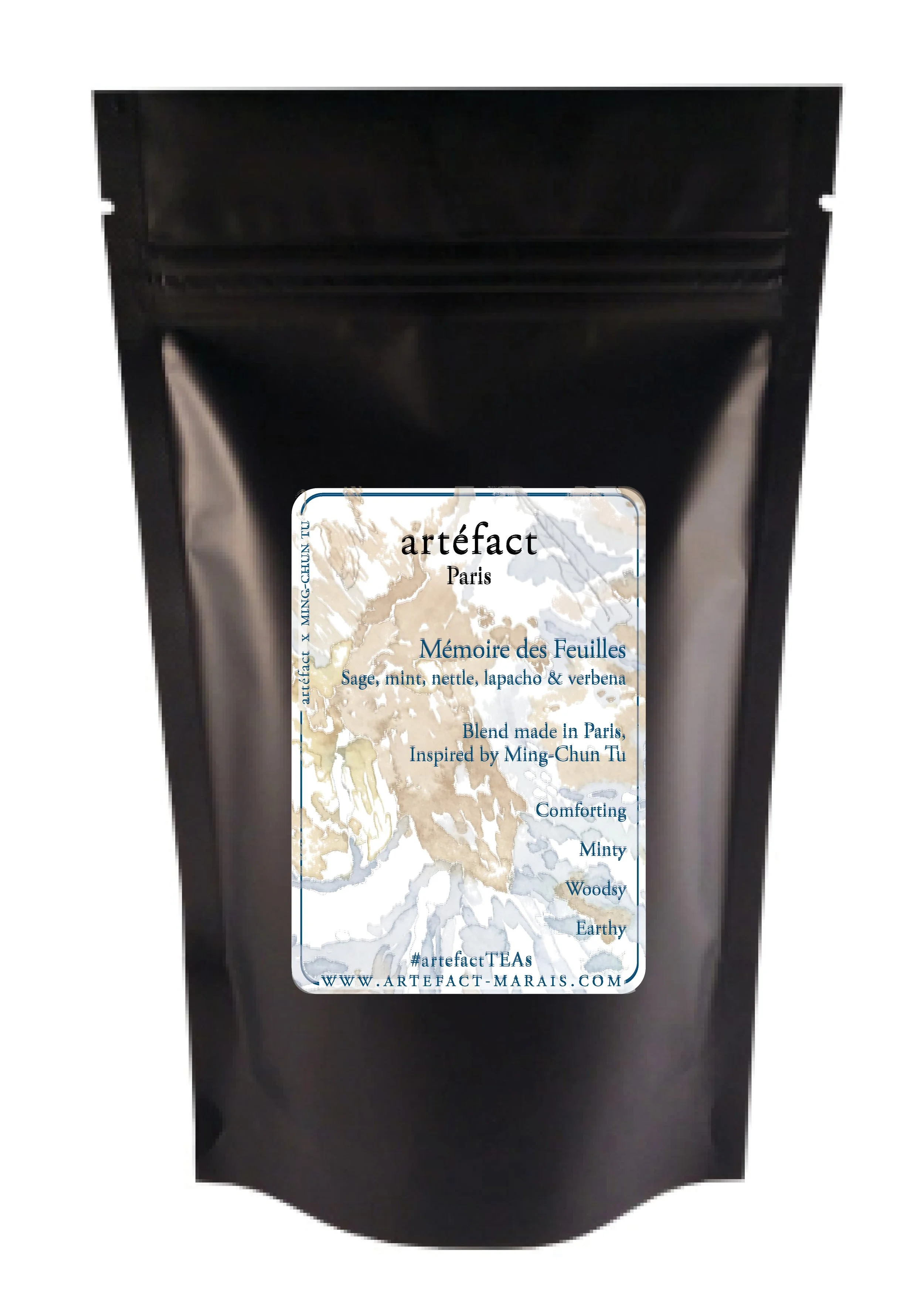 Black tea package with label reading 'artéfact Paris' and tea blend description, featuring a map illustration and website URL.